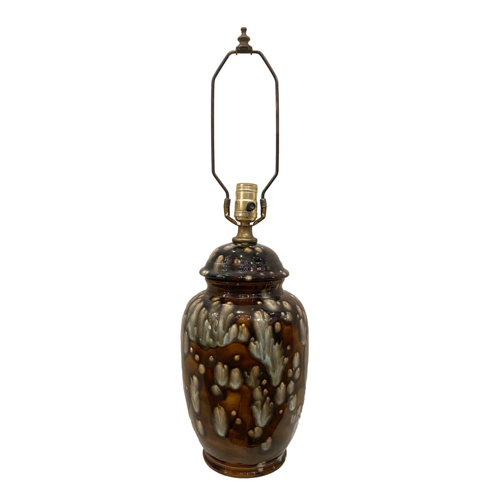 A single Italian circa 1950's drip-glazed ceramic table lamp in brown with white tones.

Measurements:
Height of body: 14