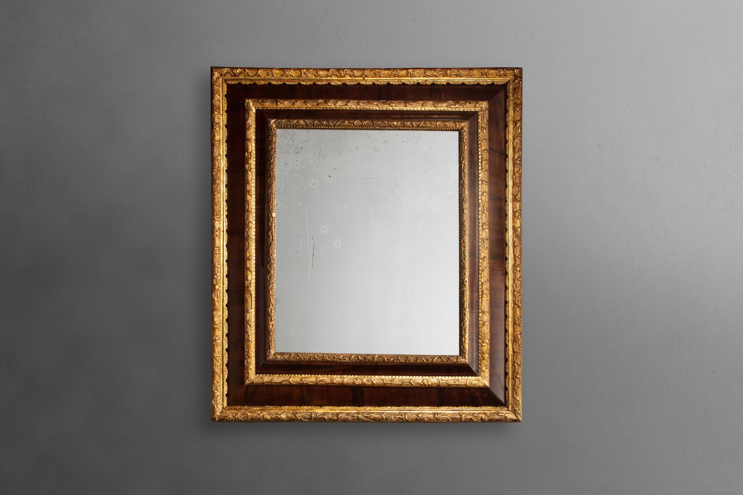 Rectangular mirror, lacquered olive wood, gilt bronze.