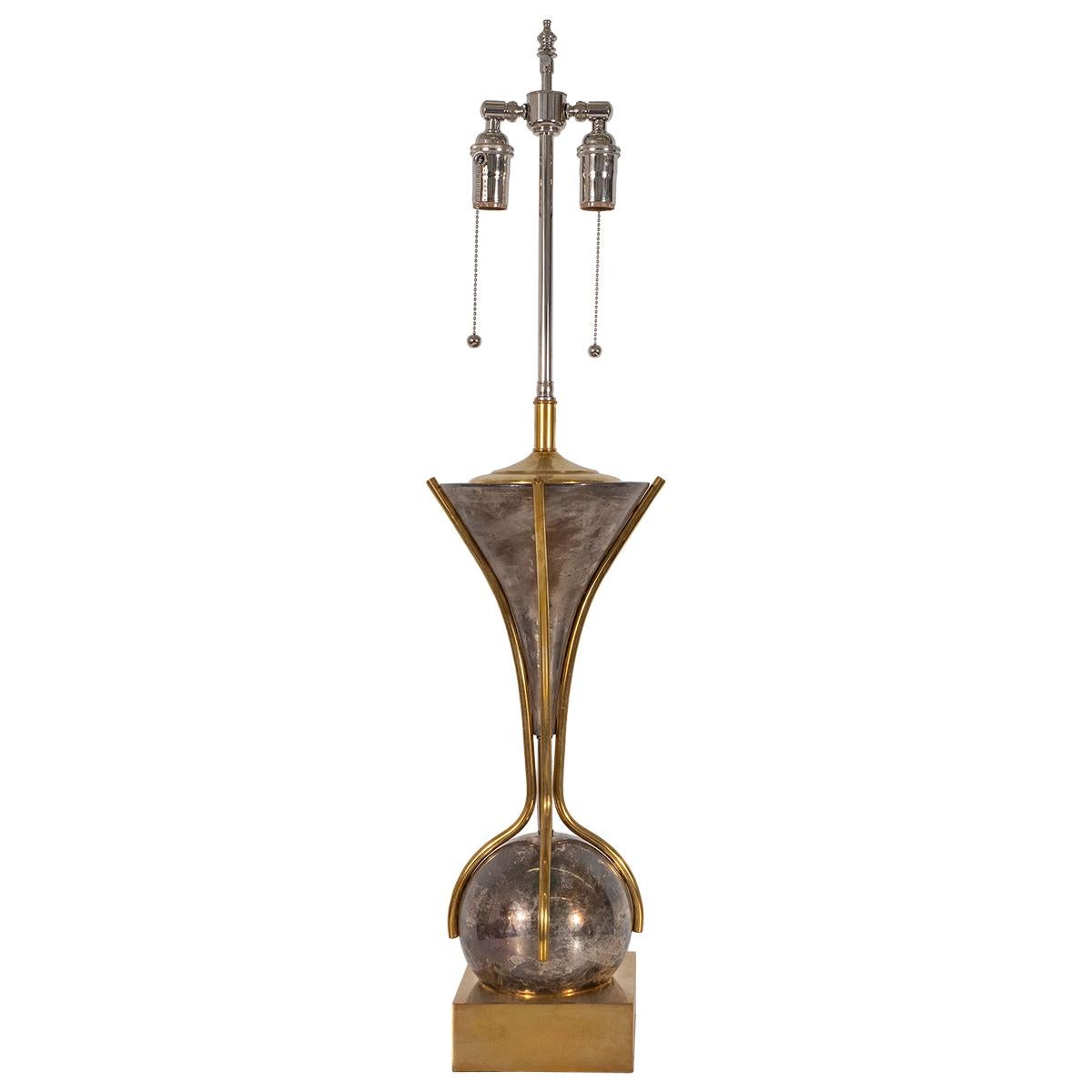 Single brass table lamp with mixed polished brass and silvered brass finish.