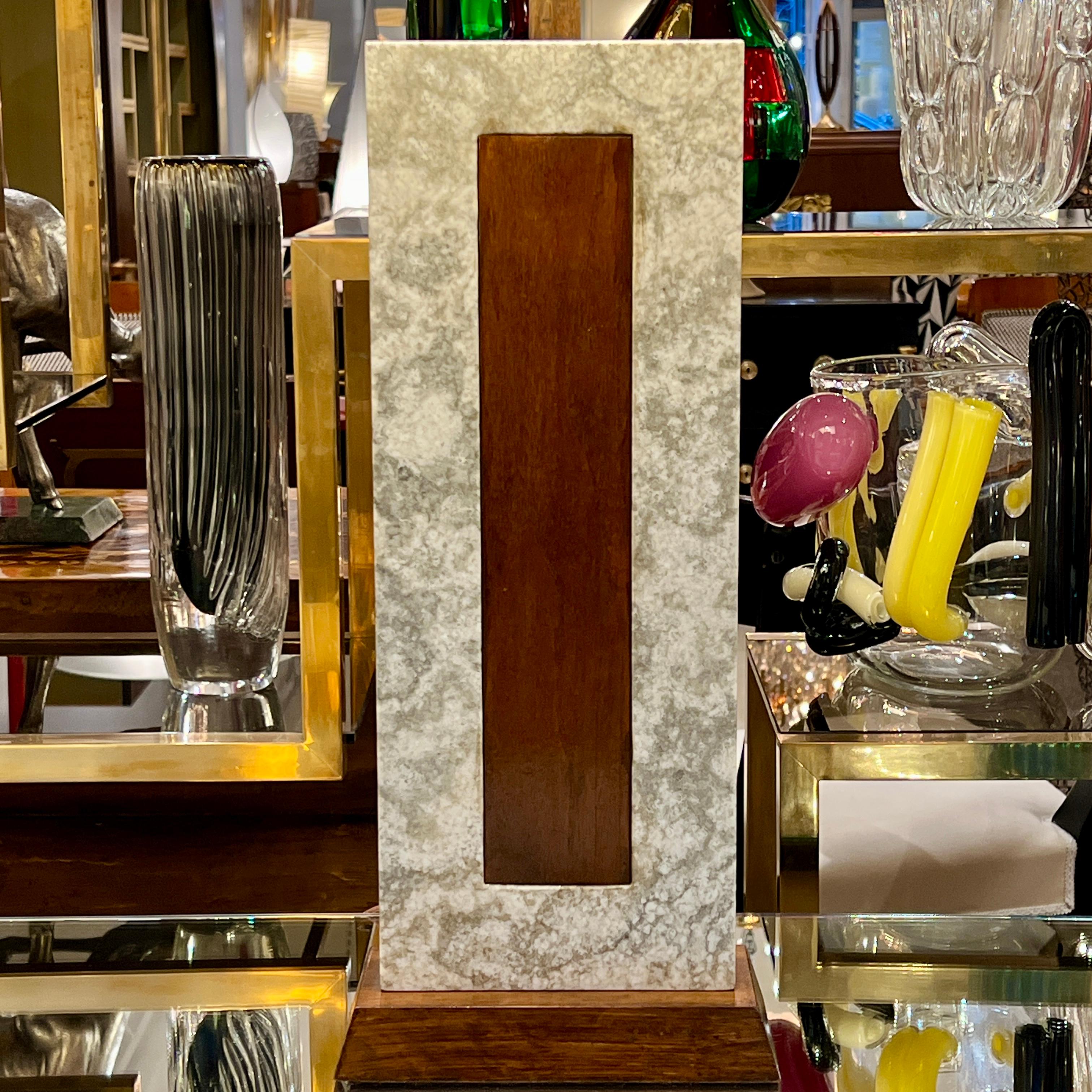 A Modernist rectangular table lamp
Marble with walnut details.

H:35
Shade W:15 shade D:13 inches.