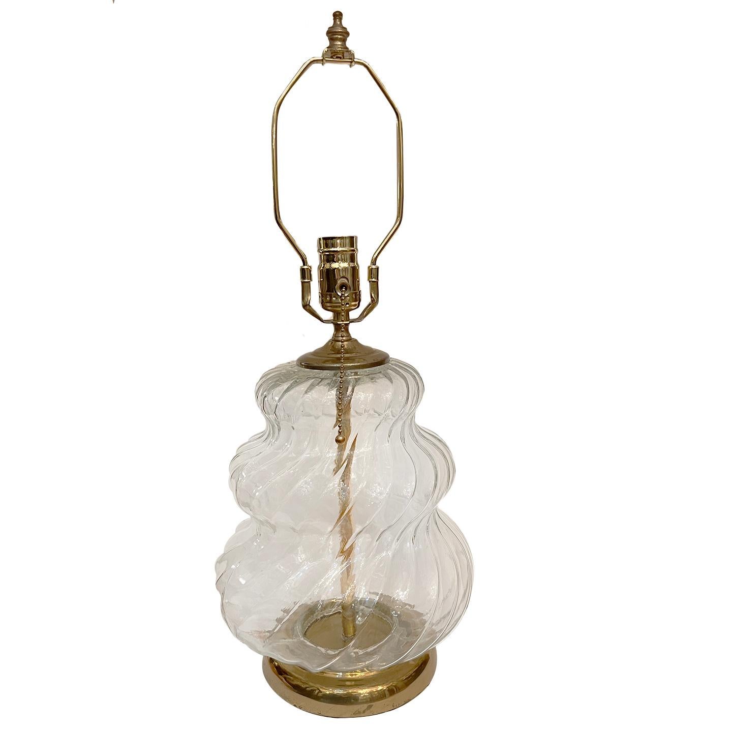 A single circa 1960's Italian molded glass lamp with brass base.

Measurements:
Height of body: 12