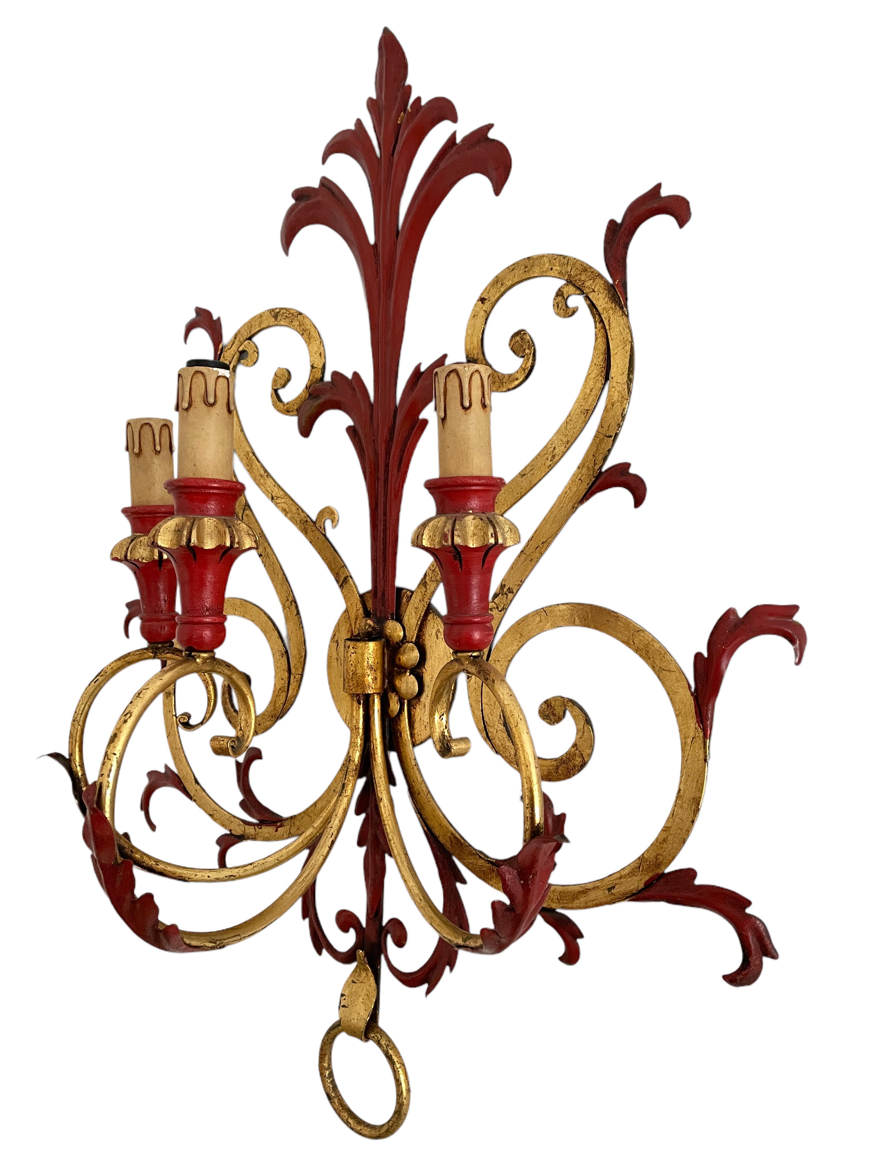 A single metal gilded and red colored toleware 3-light sconce. The fixture requires three European E14 candelabra bulbs, each bulb up to 40 watts. The wall light has a beautiful color and gives each room an eclectic statement. Light bulbs are not
