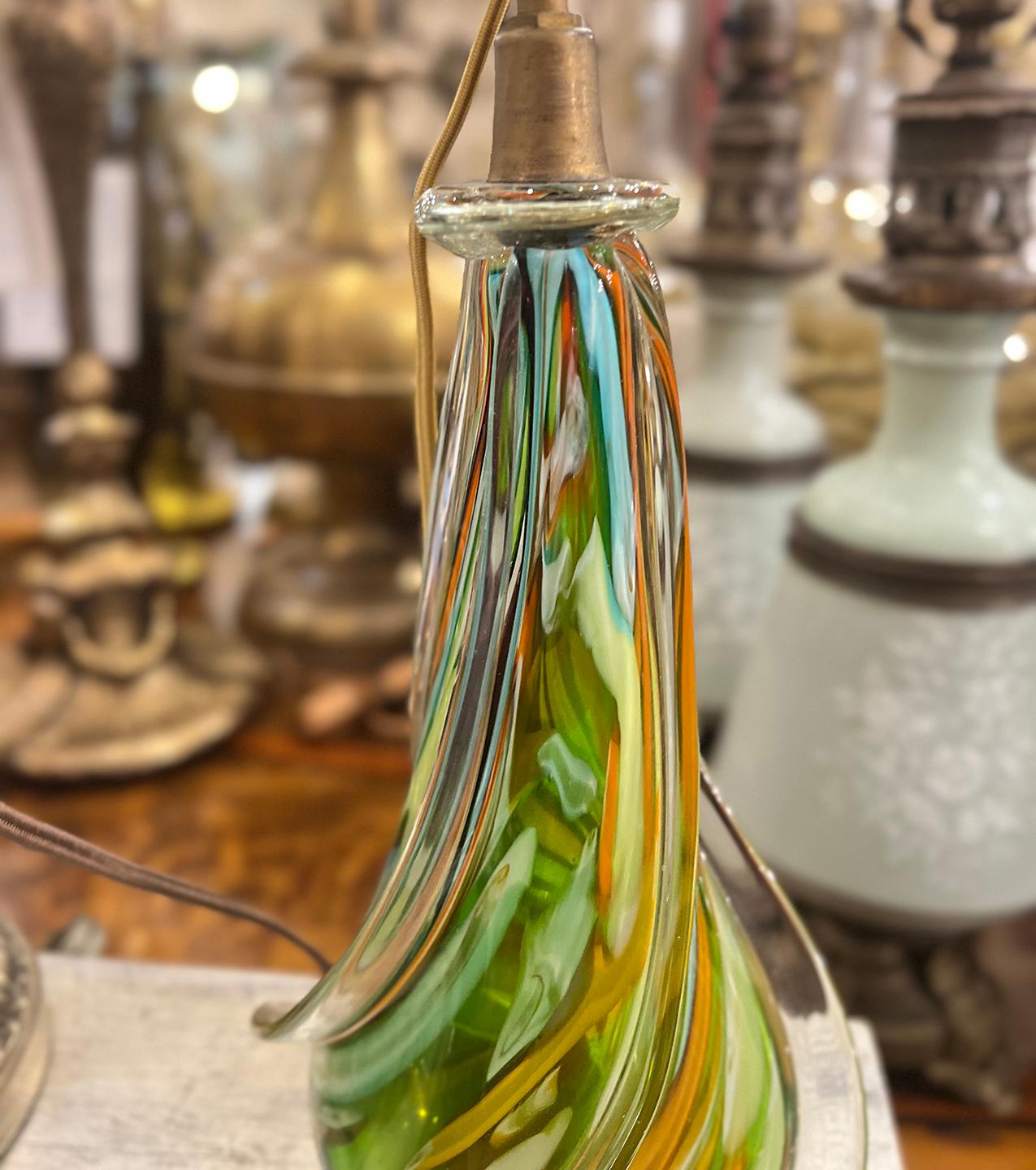 An Italian circa 1950's multi-colored hand-blown Murano glass lamp.

Measurements:
Height: 11