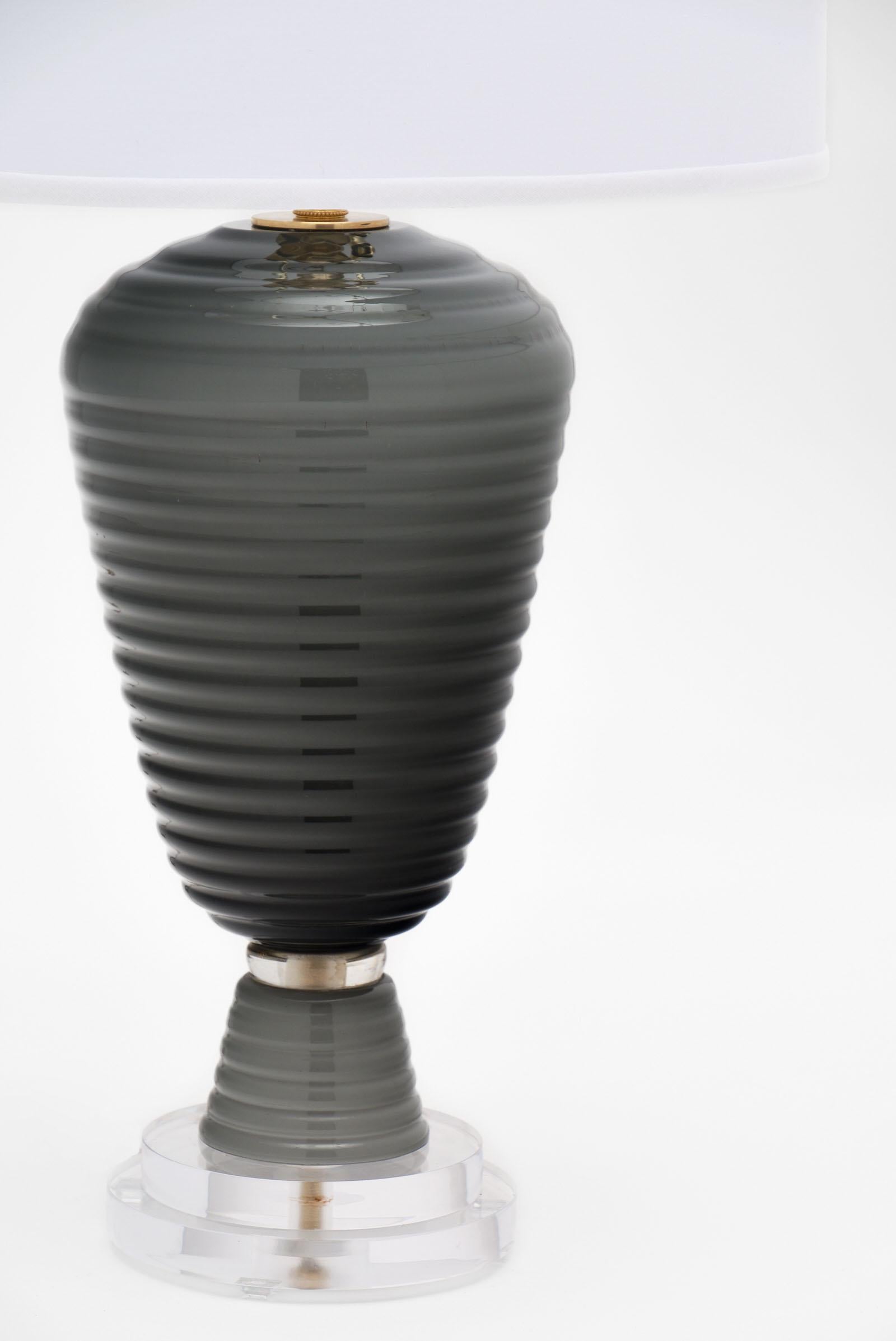 A single gray Murano glass lamp with a “beehive” shape by A. Dona in Murano. This hand blown, unique piece is mounted on a Lucite base. It has been newly wired to fit US standards.