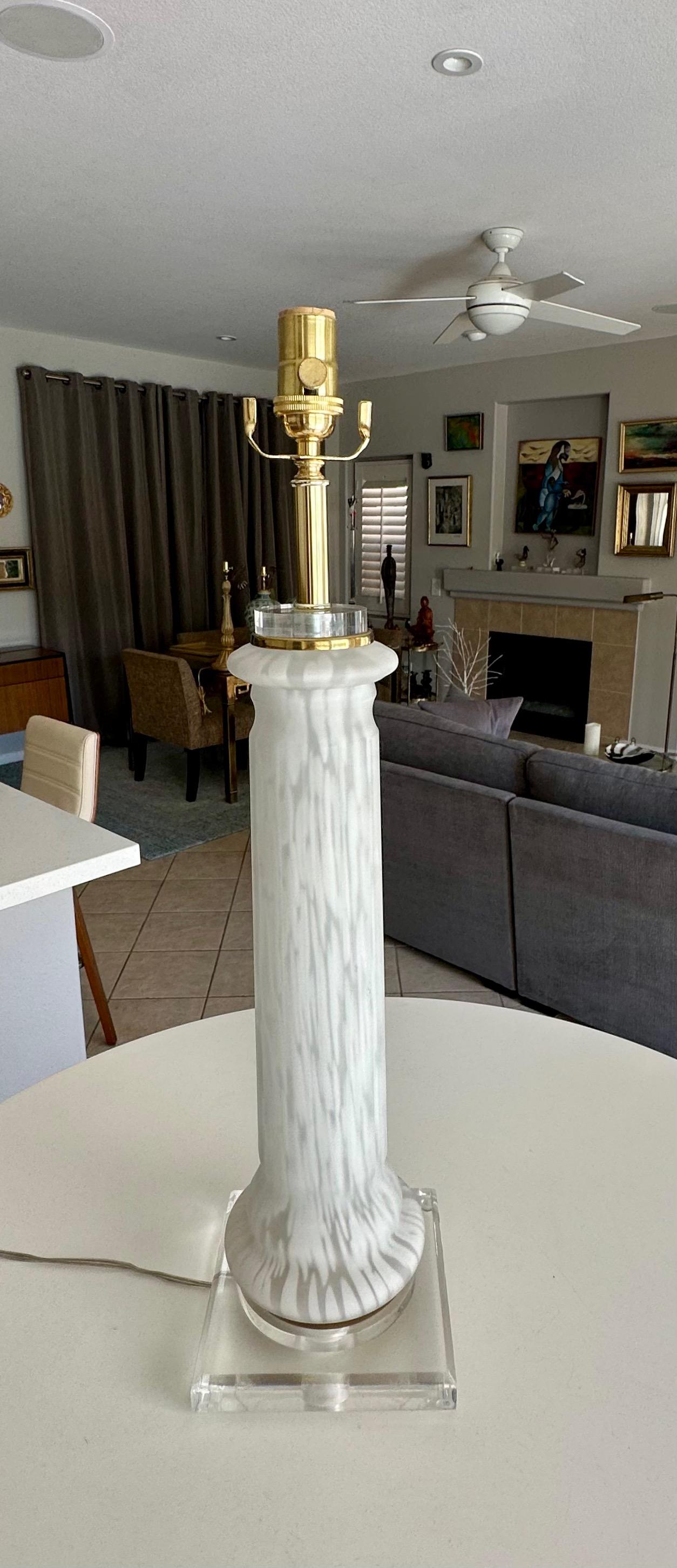 Single Murano hand blown clear and white mottled or splatter glass lamp on an acrylic base, attributed in Mazzega. Newly wired with 3-way brass sockets and cord. Overall height to top of socket is 27