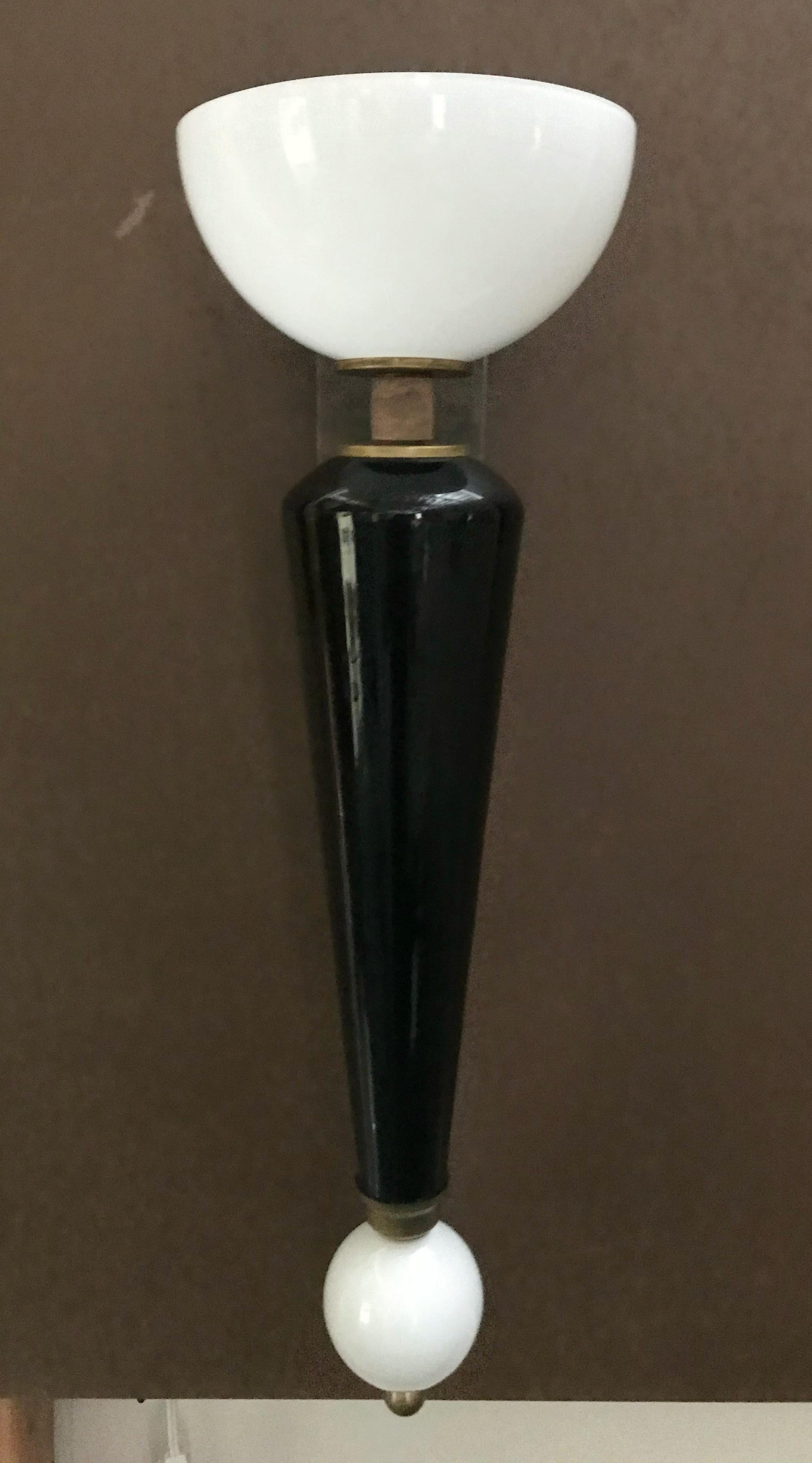 Italian torchere wall sconce with hand blown white Murano glass shade and black Murano glass stem, mounted on brass frame / Made in Italy.
2 Lights / E12 or E14 type / max 40W each.
Measures: height 27 inches, width 8.5 inches, depth 10 inches
1