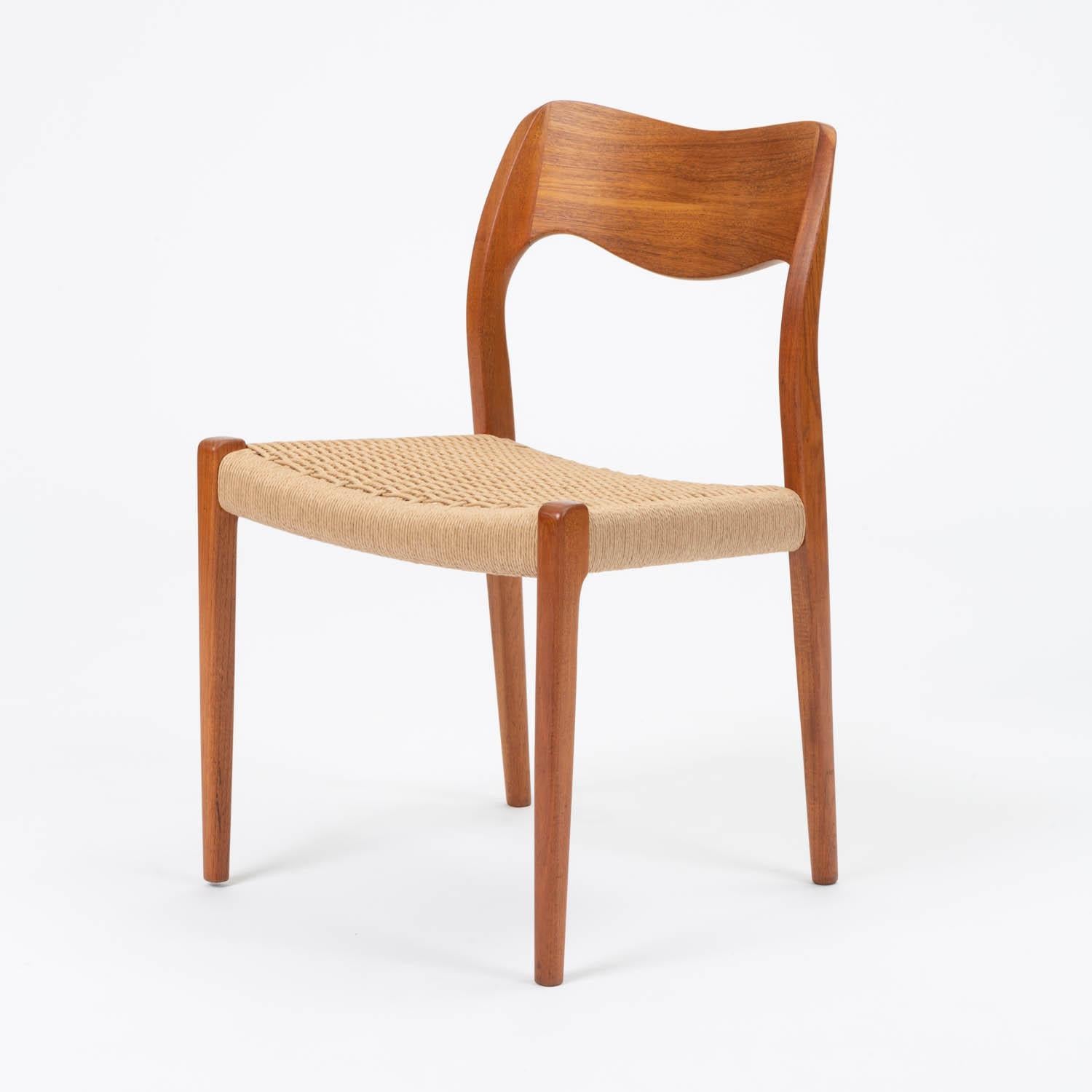 A single Niels Møller Model No. 71 dining chair in solid teak with Danish paper cord seat. Designed in 1951 and produced by J. L. Moller Mobelfabrik. The chair feature a solid wood frame that is impeccably shaped. Møller often spent up to five years