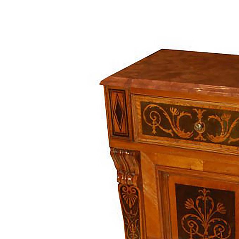 Single Baroque Revival night stand in walnut and ebony with a single drawer above a cabinet door with interior shelves. Brown marble top.