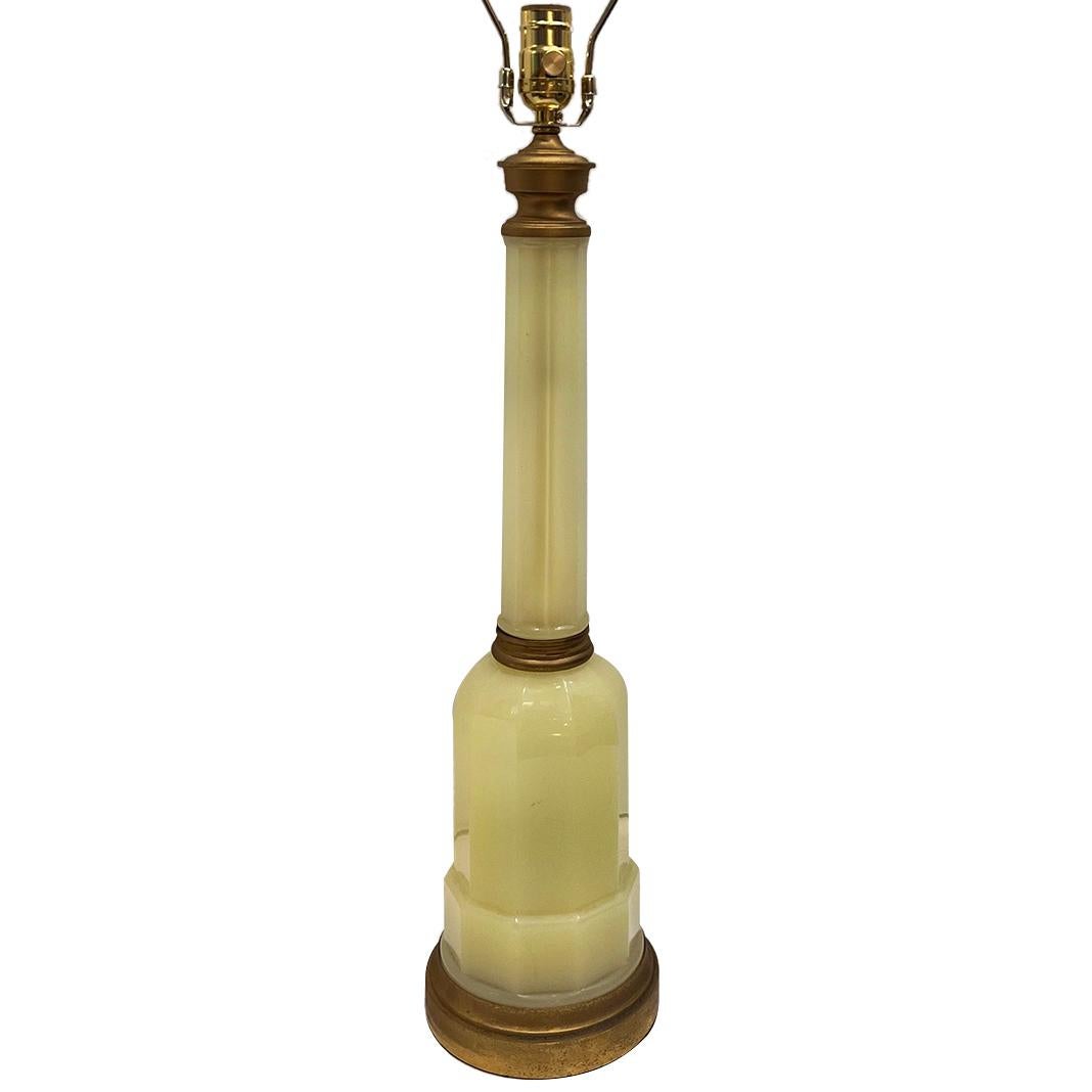 A circa 1920's French opaline glass table lamp with gilt base.

Measurements:
Height of body: 23.5