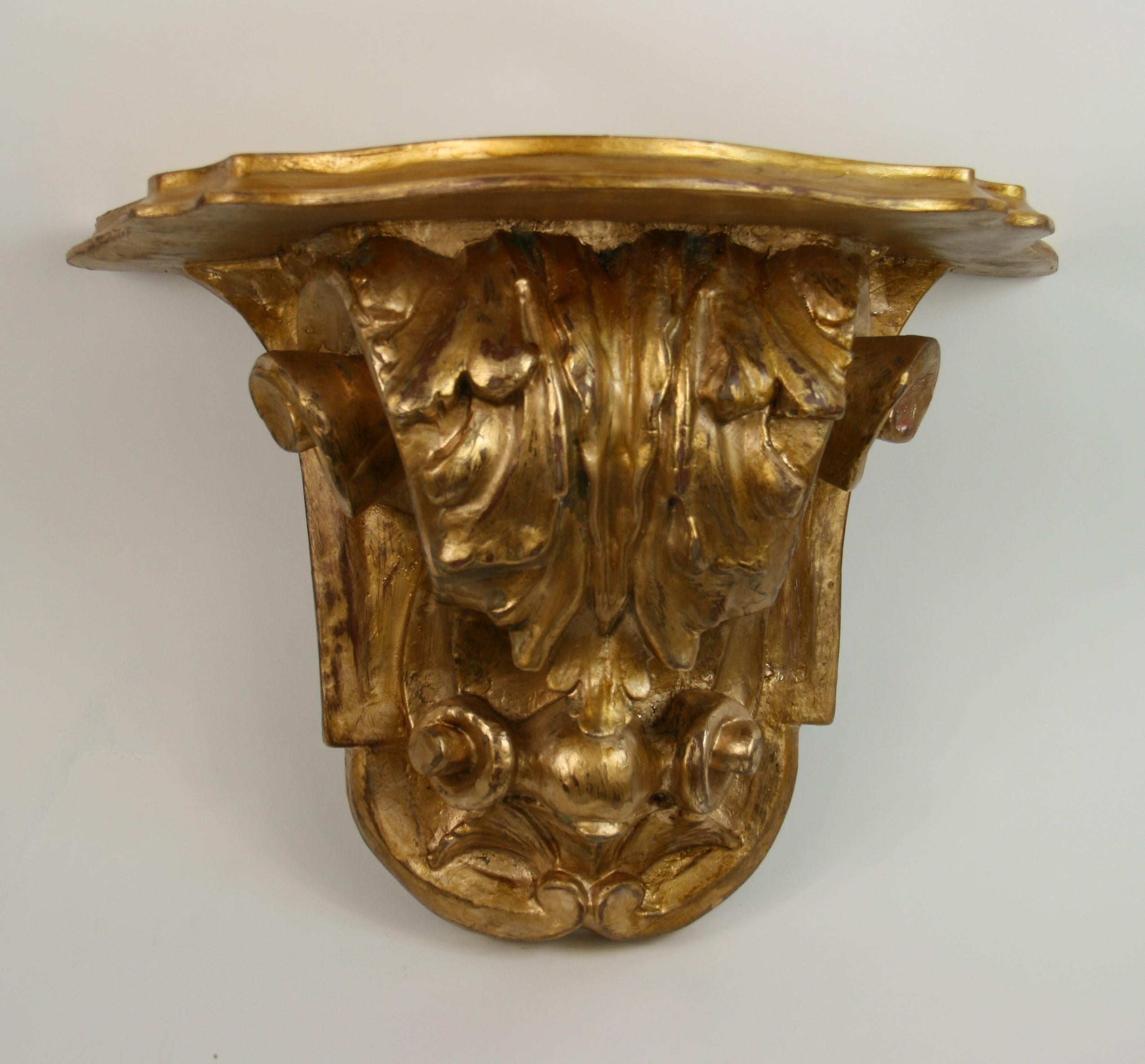 8-264 Italian giltwood and composition oversized wall bracket with elaborate details.