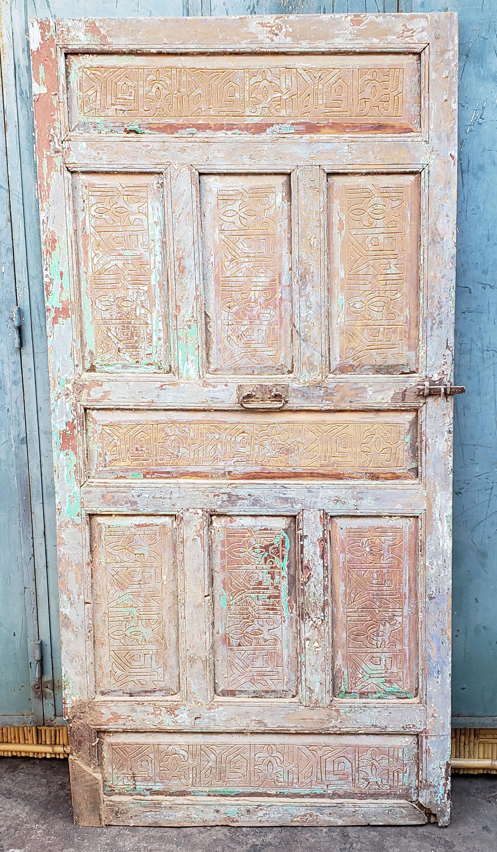 Old and attractive single panel Moroccan door measuring approximately 78.75