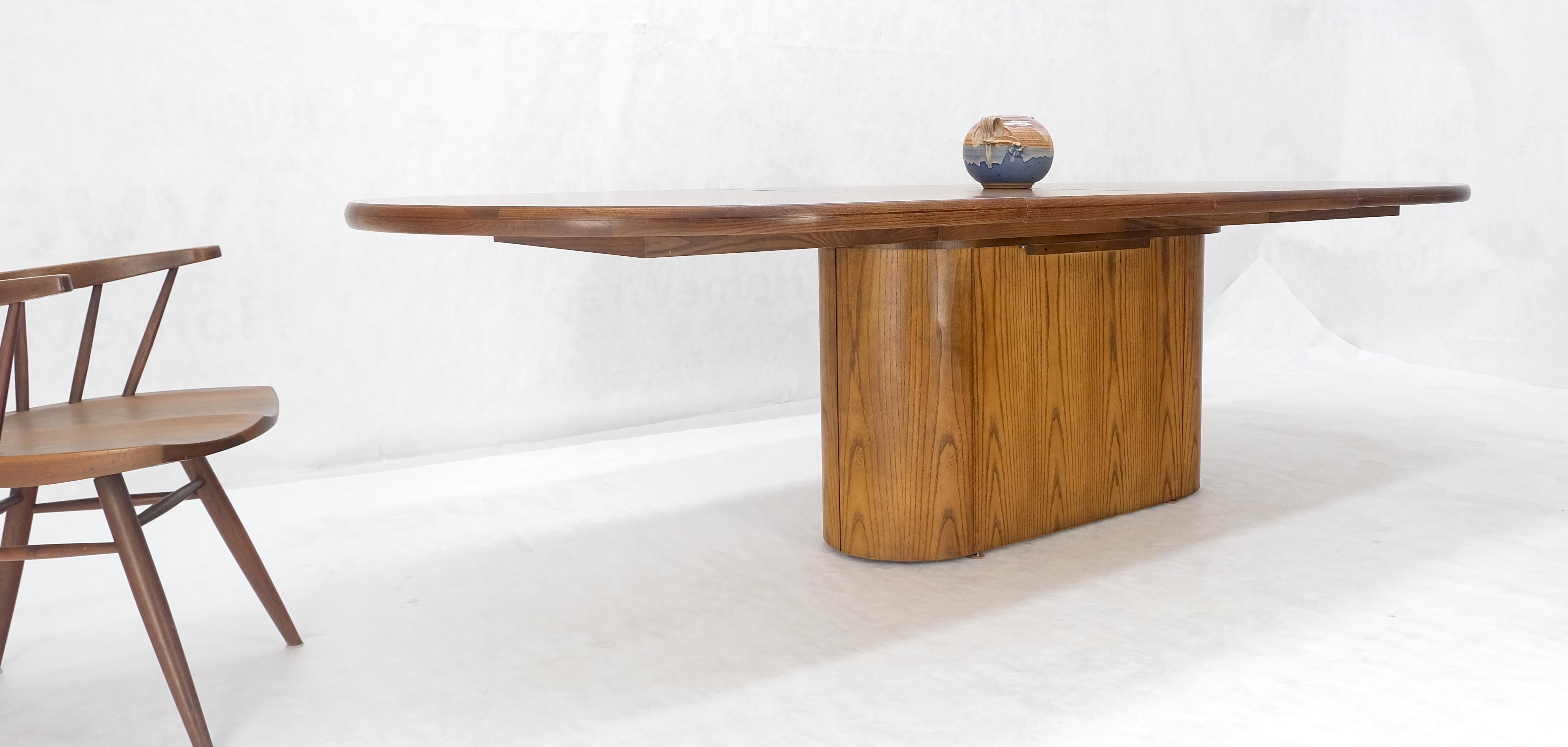 Single Pedestal Base Oval racetrack Shape Two Leaves Cerused Oak Dining Table  In Good Condition For Sale In Rockaway, NJ