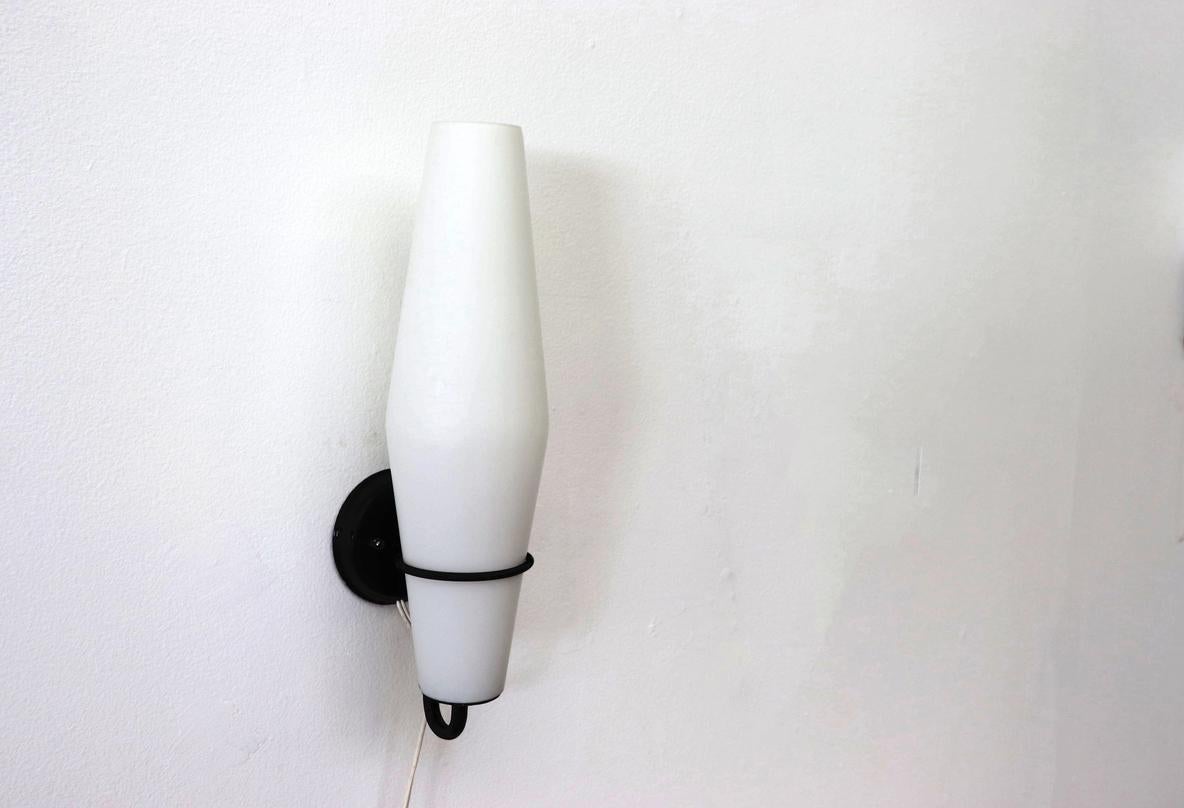 Single Philips Milk Glass and Black Enameled Metal Wall Sconce In Good Condition For Sale In Los Angeles, CA