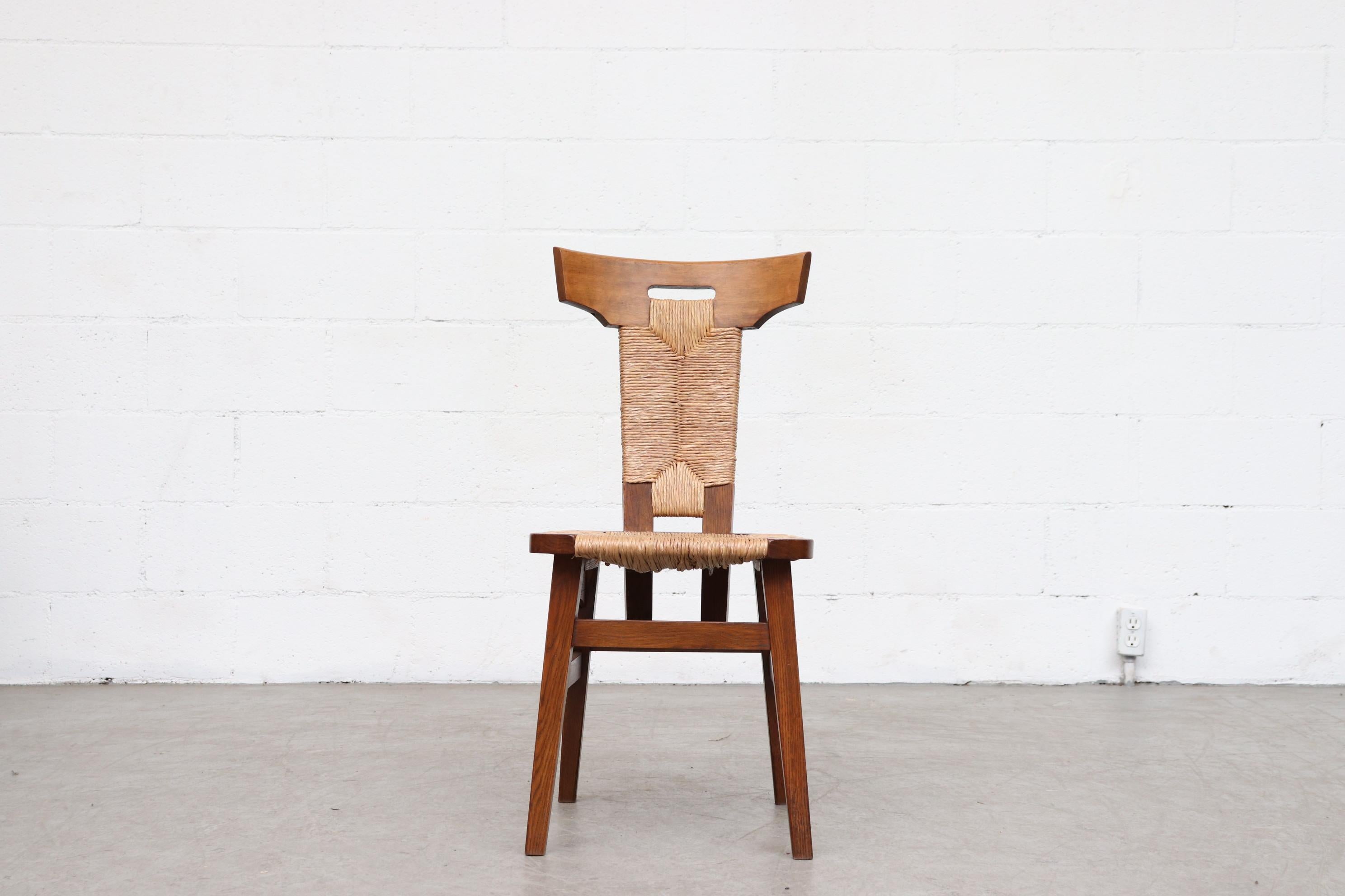 Single Pierre Chapo style Brutalist rush and walnut side chair with handle cutout. In original condition with wear consistent with it's age and usage.