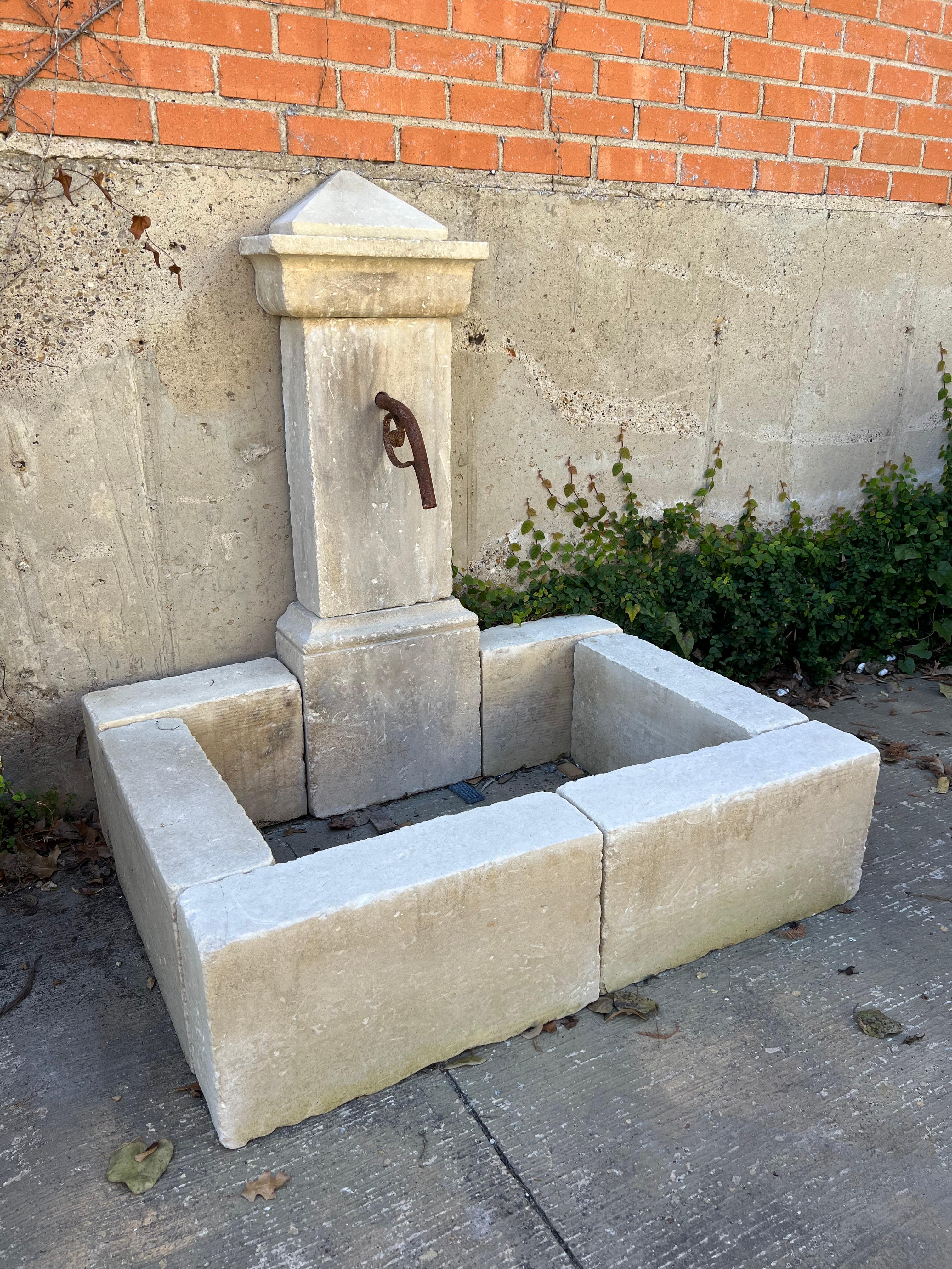 Italian Single Pillar Carved Limestone Wall Fountain From Southern Italy For Sale