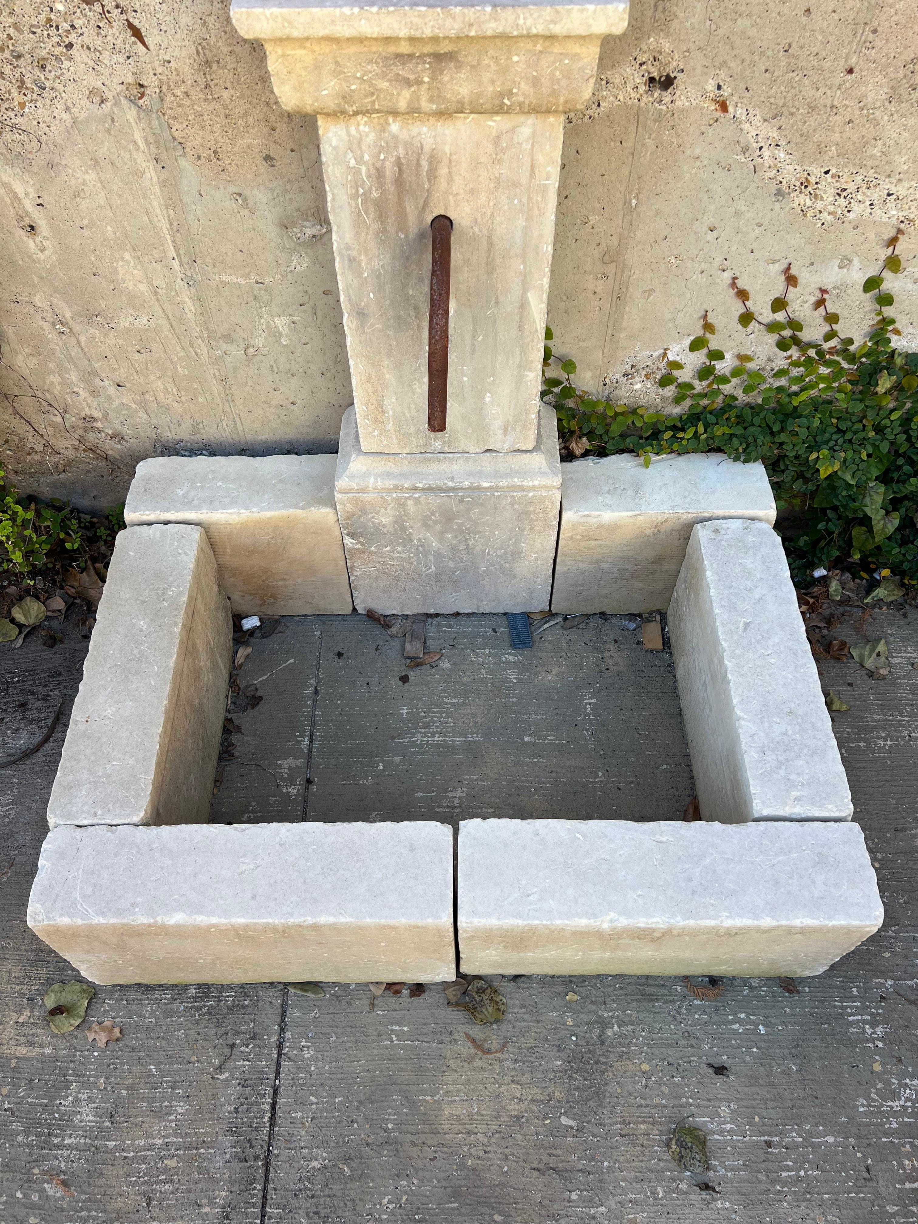 Metal Single Pillar Carved Limestone Wall Fountain From Southern Italy For Sale