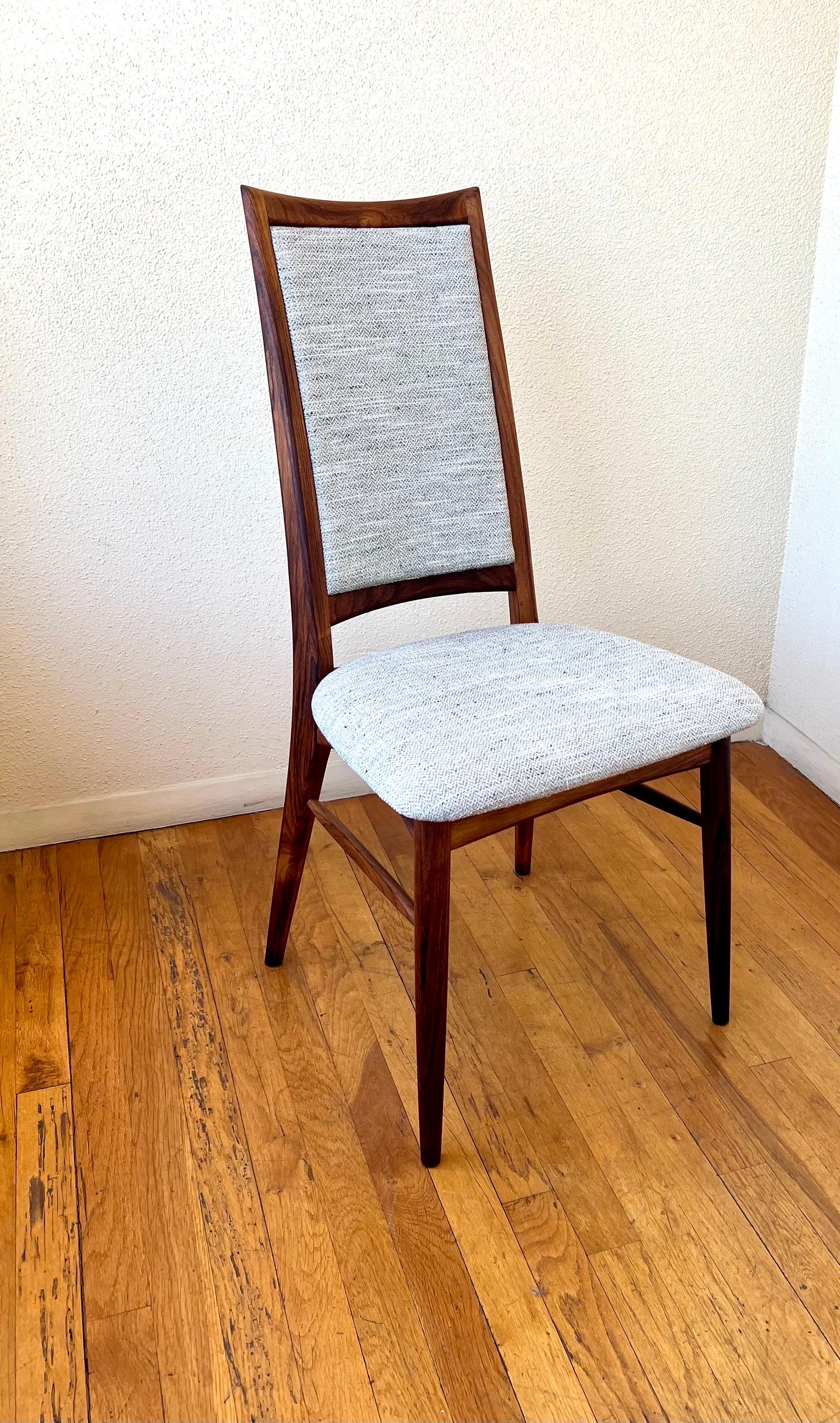 Elegant lines and beautiful on this single tall back chair design by Niels Koefoed, solid and sturdy in beautiful solid rosewood new knoll fabric, stamped on the bottom with Danish control tag. A very rare accent desk chair.