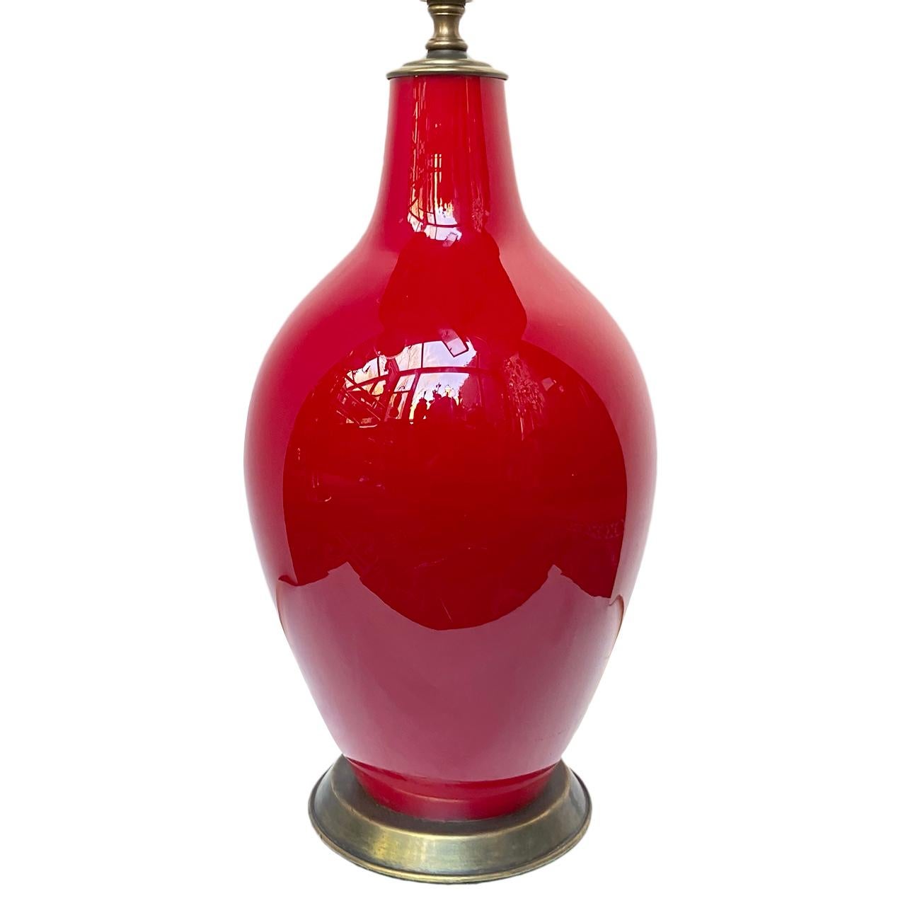 A circa 1960's Italian red glass table lamp with brass base.

Measurements:
Height of body 15