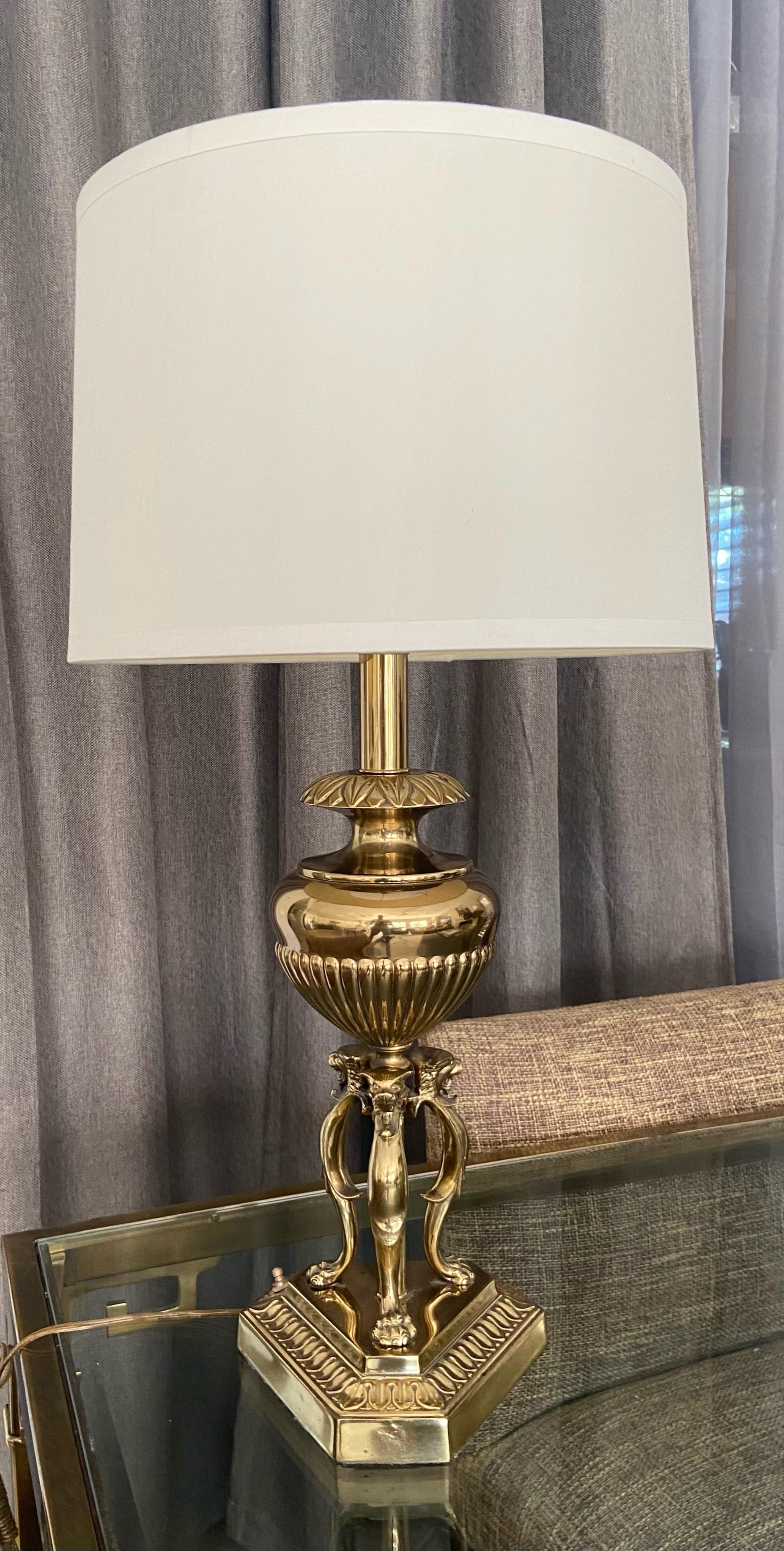 Single solid brass lion head and paw motif table lamp. Has 3-way push button on/off switch, made by the well known lighting manufacturer 