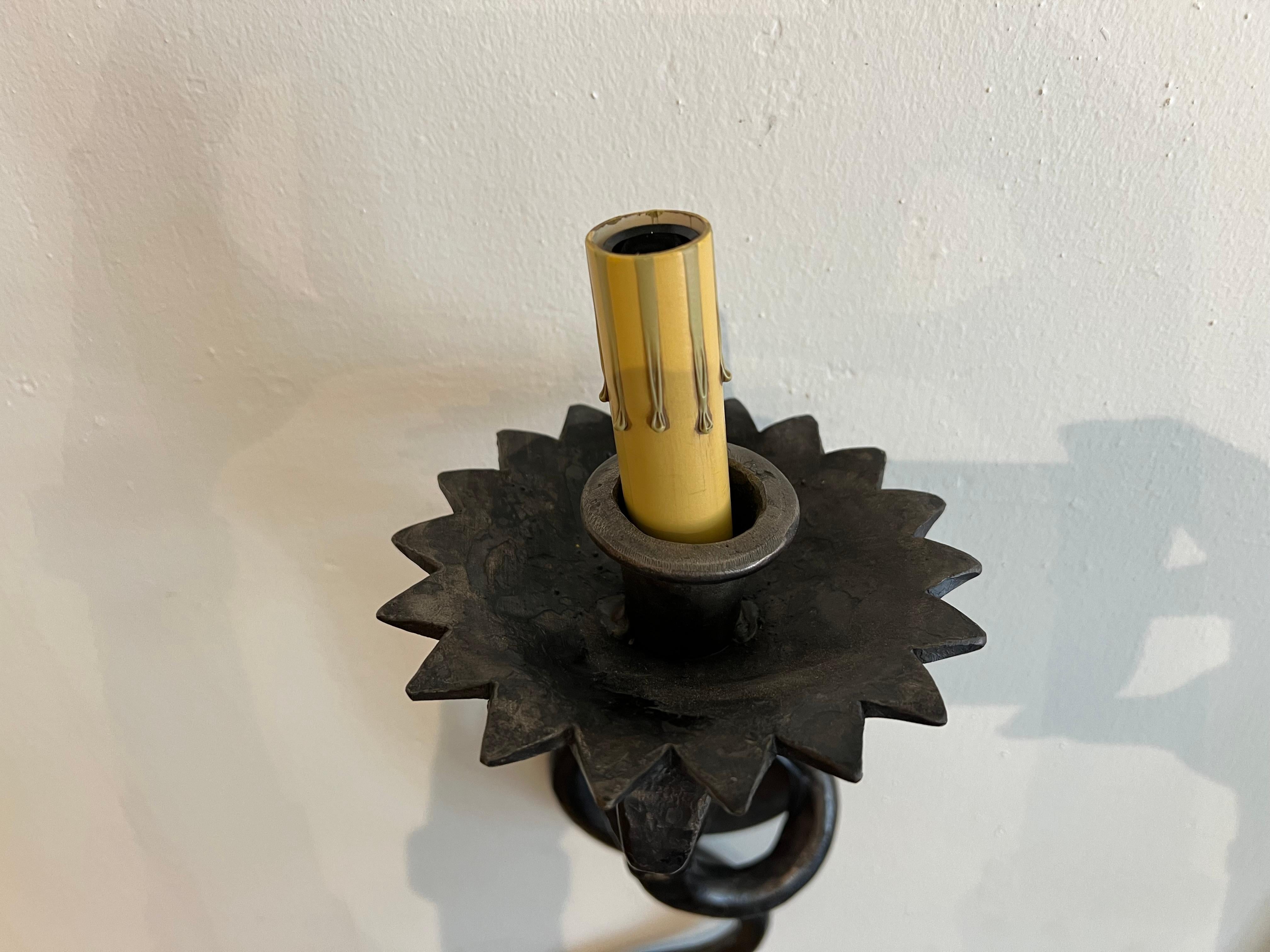 Reproduction serpent sconce in a gun metal finish. These are available in custom lengths in both non-electrified and electrified versions and can be sold in pairs.