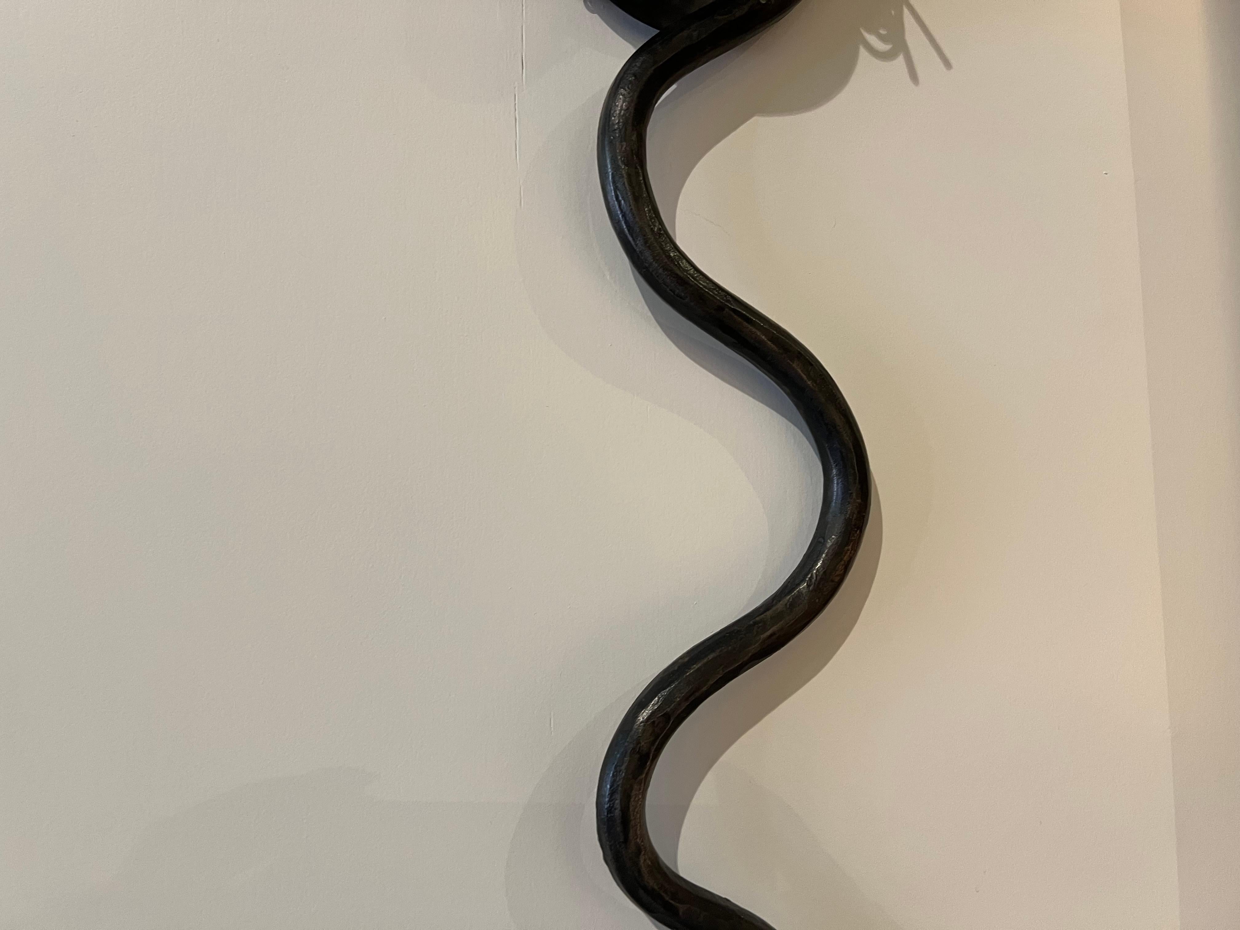 Contemporary Single Electrified Serpent Sconce in gunmetal wrought iron finish For Sale