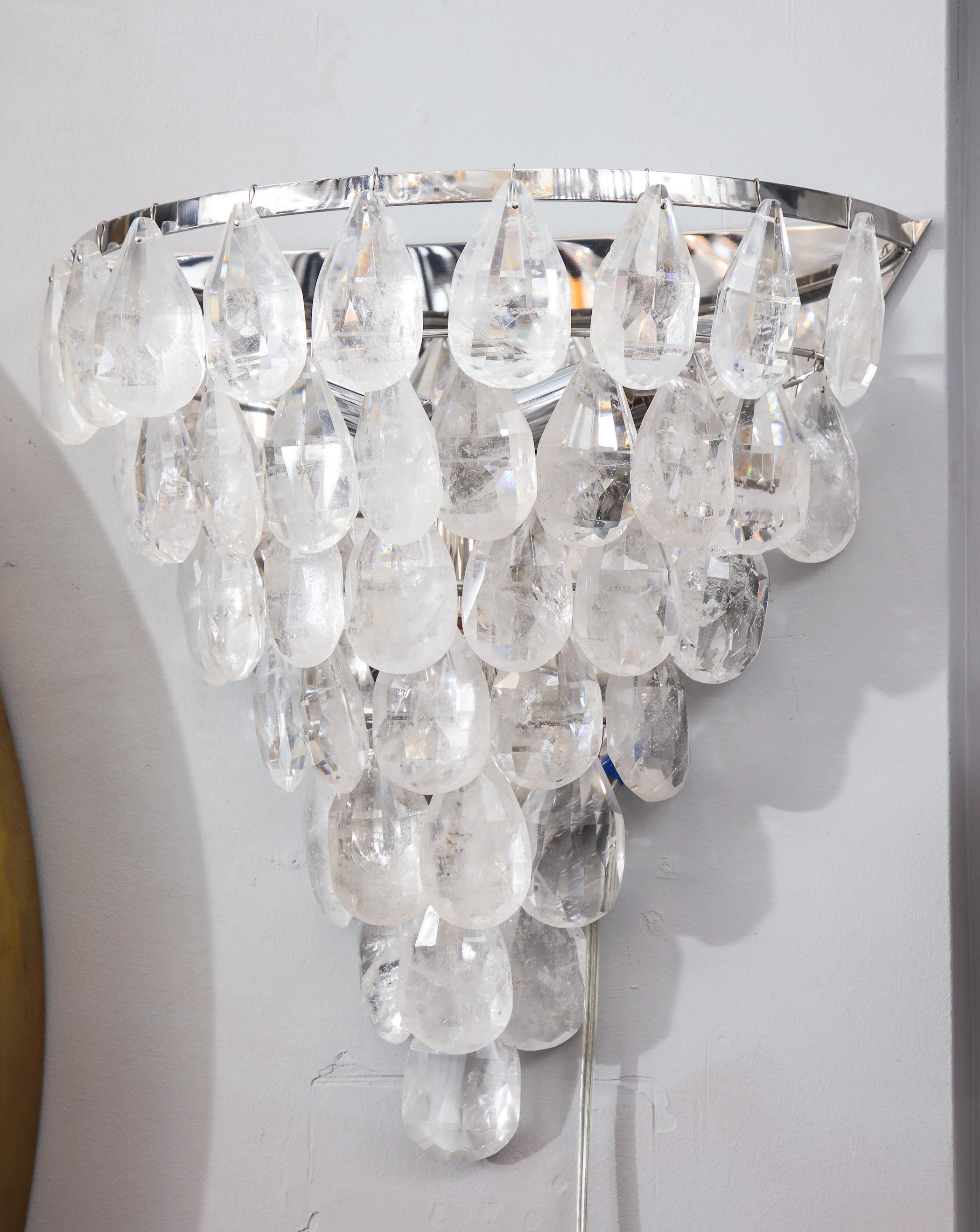 Glamorous single rock crystal cascading sconce in polished nickel finish. Customization is available in different sizes and finishes.