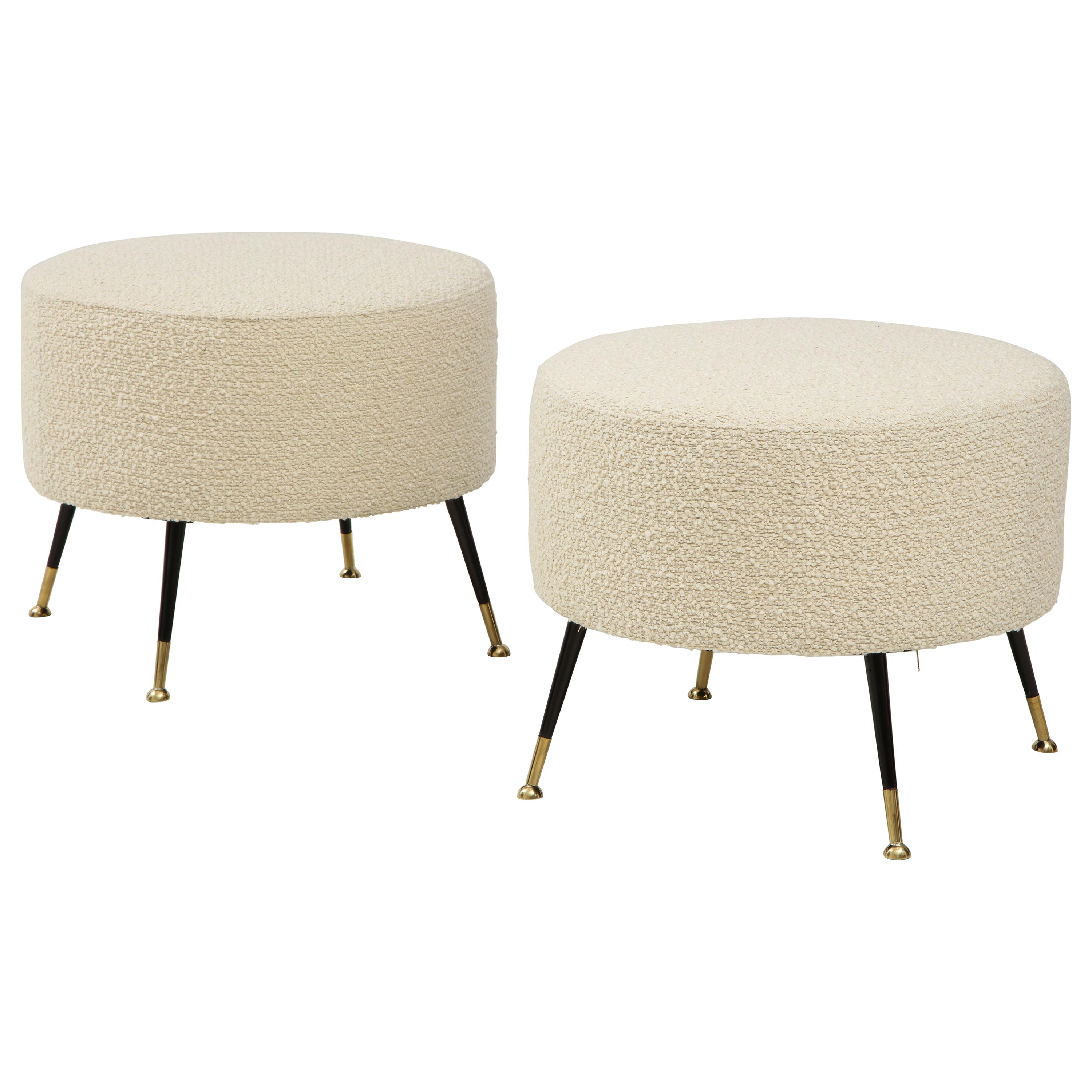 Single round stool or pouf was hand made in Florence, Italy, by a master furniture artisan. Round seat in imported Ivory Boucle fabric with black enamel and brass legs. This stool or pouf is on display at the Gallery at 200 Lex at the New York