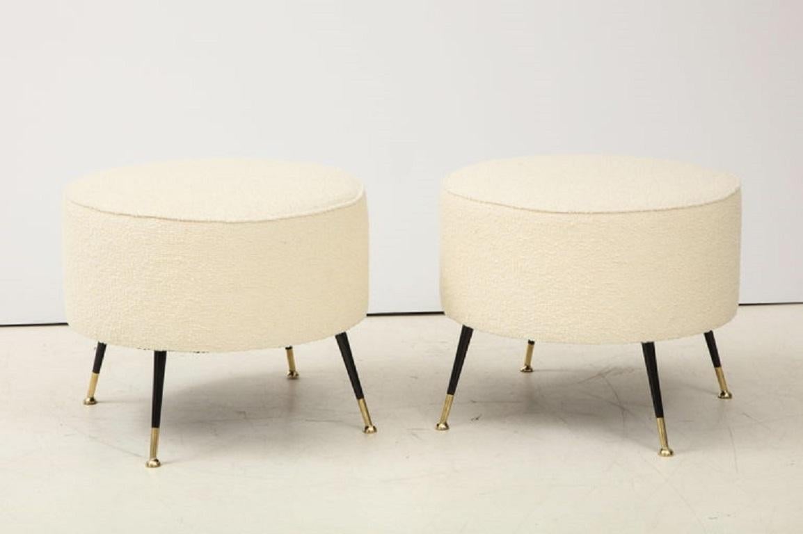 Single round stool or pouf was hand made in Florence, Italy, by a master furniture artisan. Round seat in imported Ivory Boucle fabric with black enamel and brass legs. Iconic Italian design. This stool or pouf is on display at the Gallery at 200