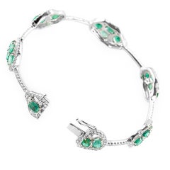 Single Row 18 Karat White Gold Diamond and Emerald Bangle