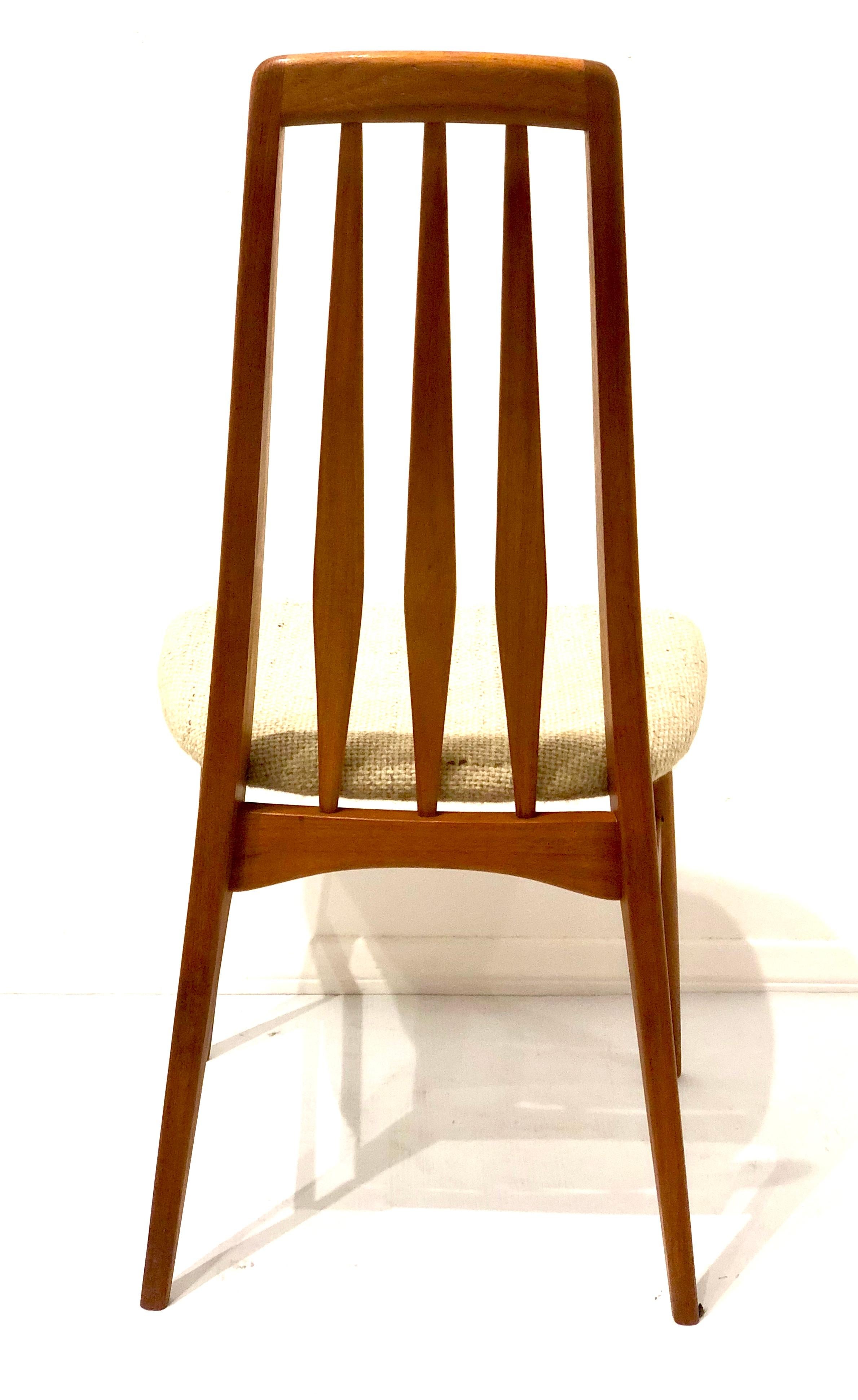 Elegant lines and beauty on this single tall back chair design by Niels Koefoed, famous Eva chair, solid teak solid and sturdy in its original fabric in an oatmeal color.