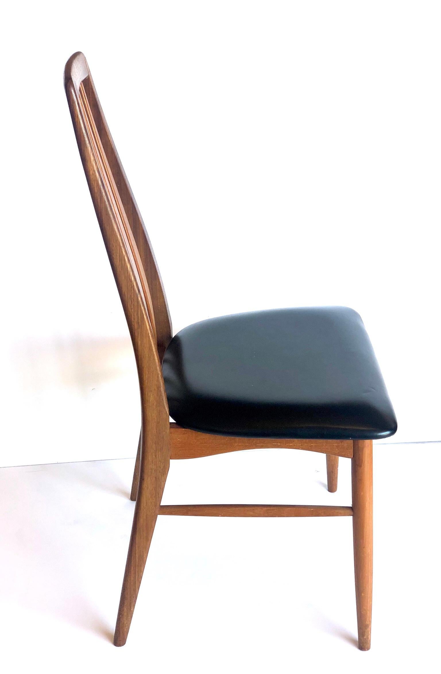 Elegant lines and beauty on this single tall back chair design by Niels Koefoed, famous Eva chair, solid teak solid and sturdy in its original black naugahyde, stamped on the bottom with Danish control tag.