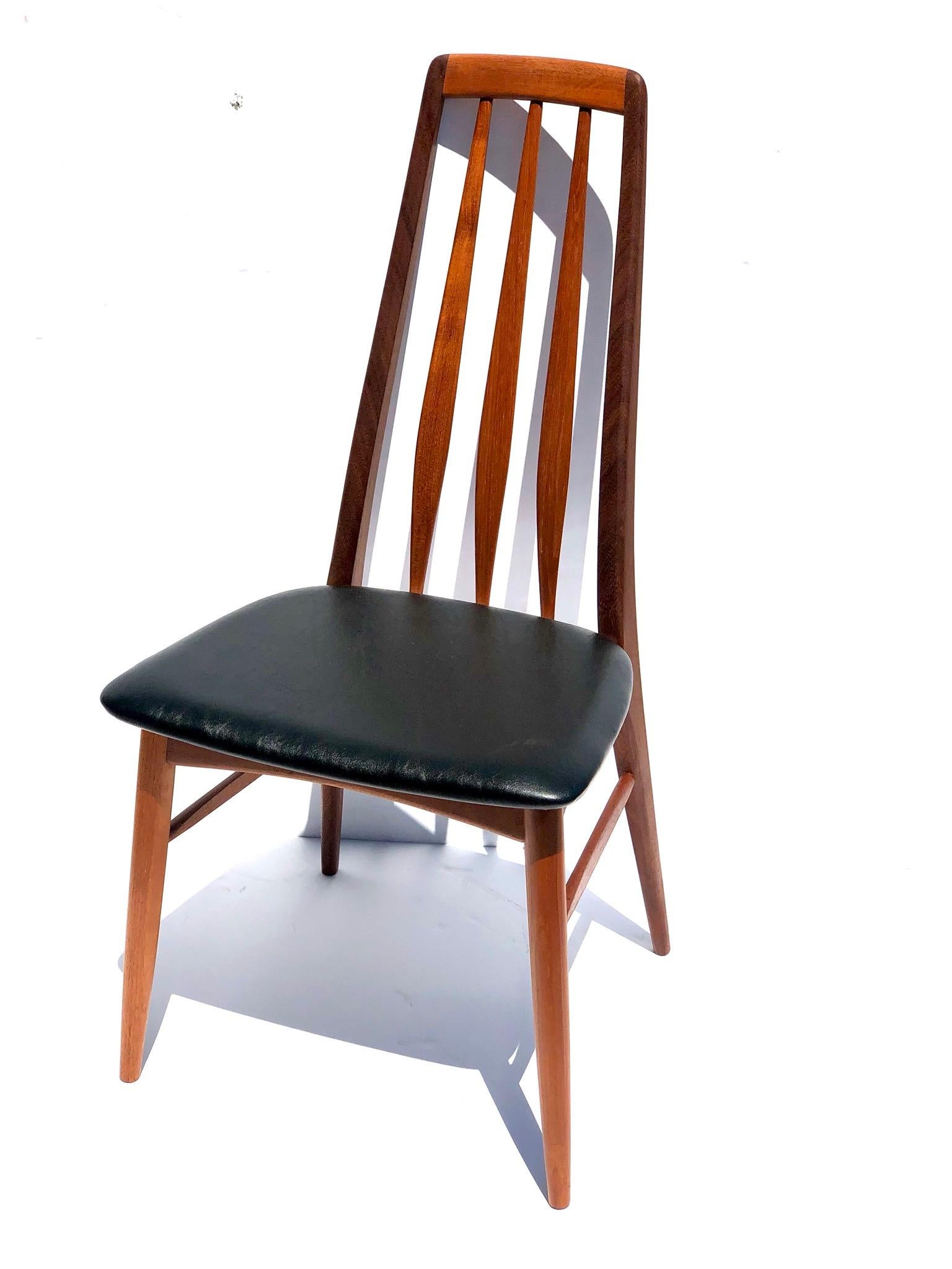 Elegant lines and beauty on this single tall back chair design by Niels Koefoed, famous Eva chair, solid teak solid and sturdy in its original black Naugahyde, stamped on the bottom with Danish control tag.