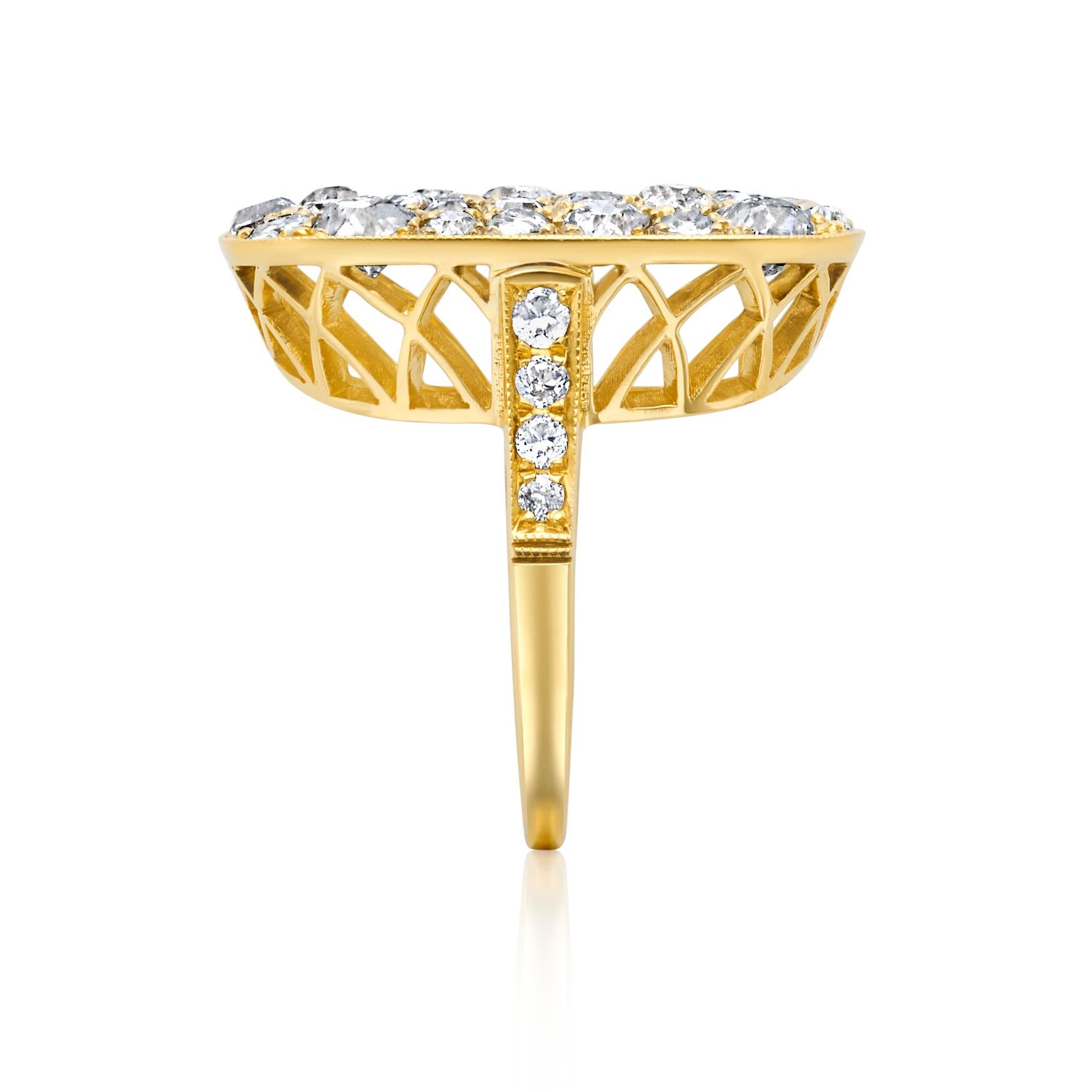From designer Single Stone, circa 2000’s, 18 karat yellow gold diamond cobblestone ring. This ring is crafted with 58 pave round old European cut diamonds in an assortment of different sizes. These diamonds have an approximate combined weight of