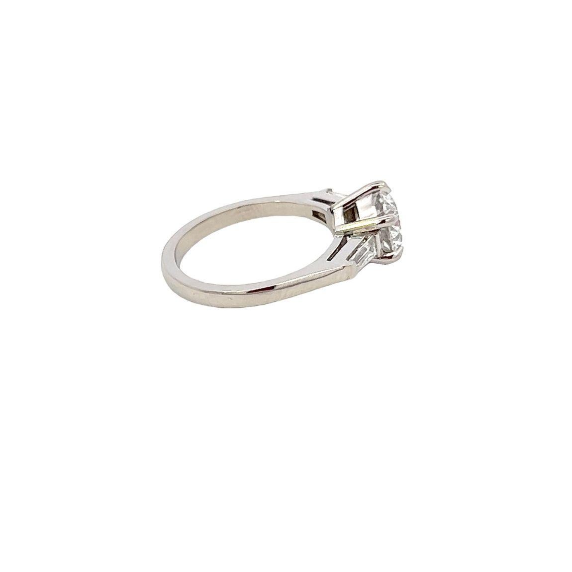 Brilliant Cut Single Stone Diamond Engagement Ring with Tapered Baguette Diamond Shoulders For Sale