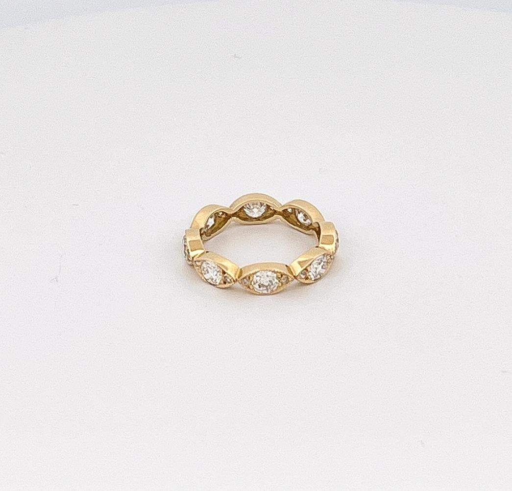 From designer Single Stone, 18 karat yellow gold diamond eternity Kelly band. This band is crafted with 8 horizontal marquise diamonds with an approximate combined weight of 1.40 carats, with G-H color and V-S clarity. This band is a size 6.75 and