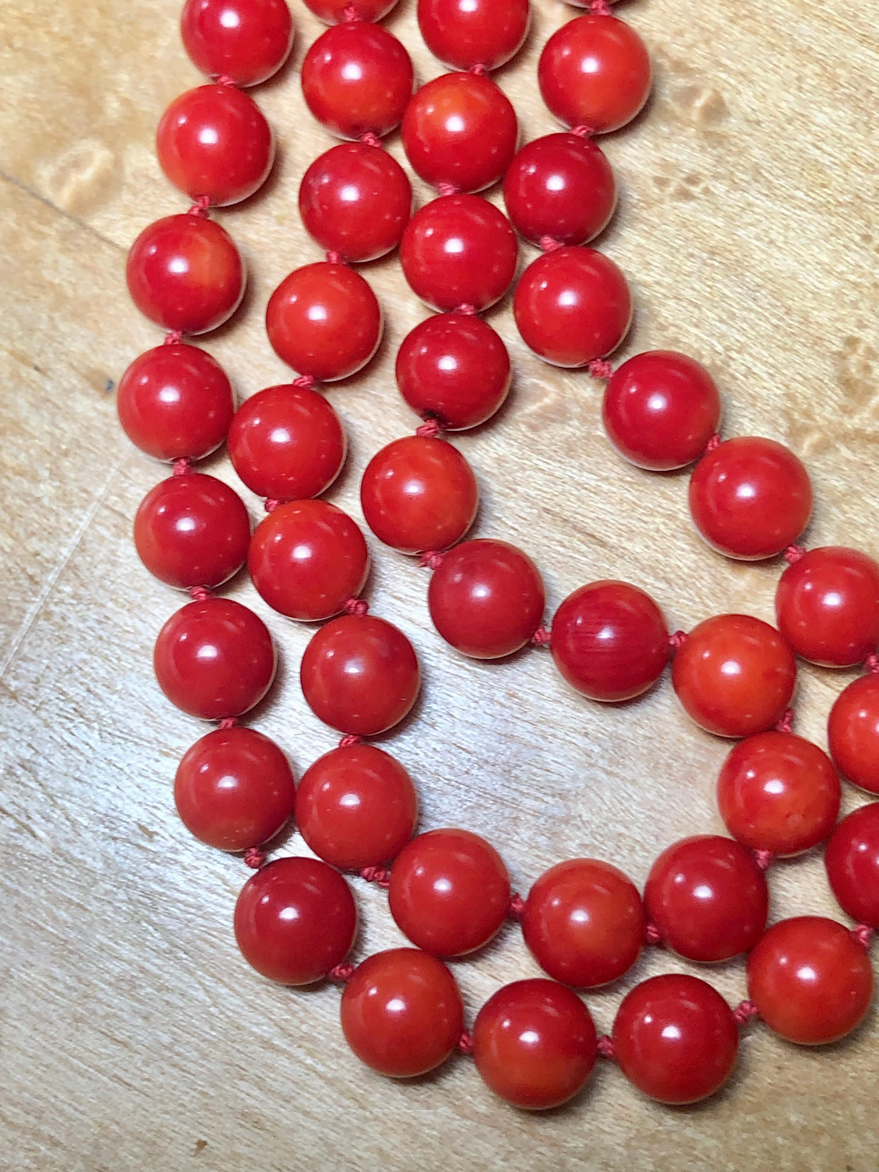 This elegant single strand and classic red coral necklace displays red coral beads measure 7.30mm and are secured by a yellow gold 14k clasp. 
Coral beads are 7.3 mm. Total length of necklace is 20 inches. 

COLOR: Orange Red with spotting
Necklace