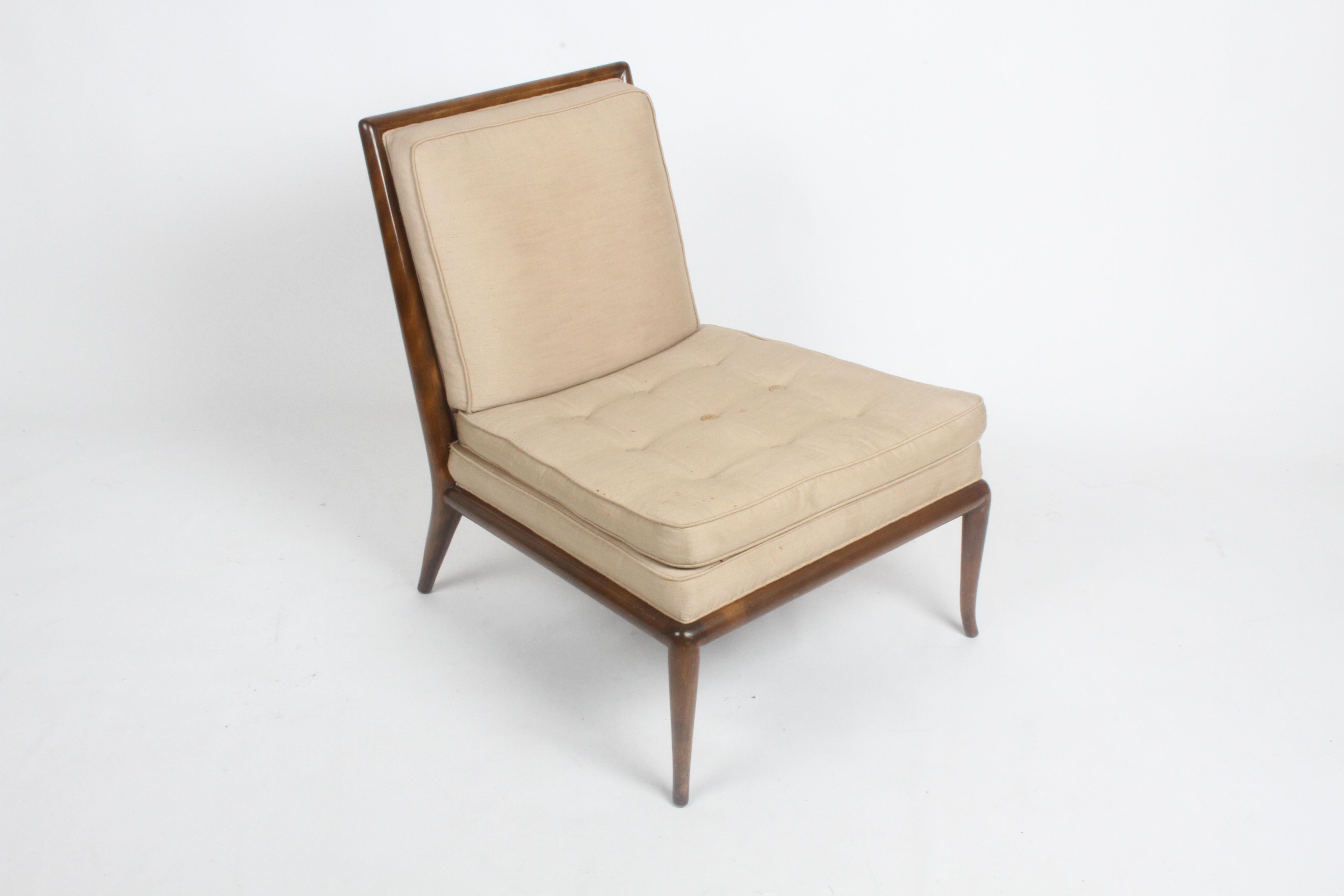 Beautiful design by T. H Robsjohn-Gibbings in original finish, with older silk upholstery. Elegant splayed legs on walnut frame, original finish shows minor scuffs. Upholstery shows stains, needs to be updated. From one owner estate, no label, home