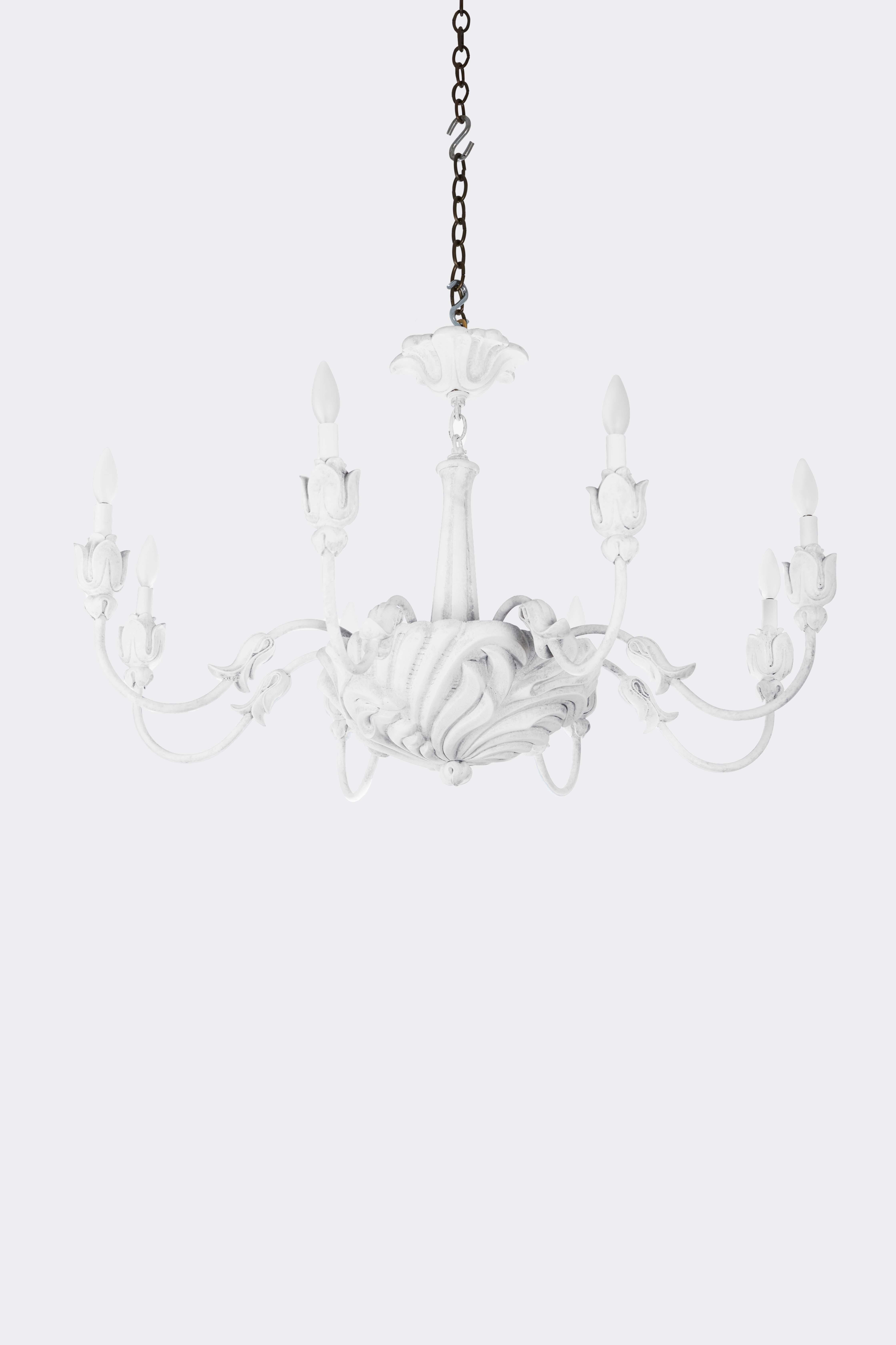 A single-tiered 8-light chandelier with shell formed dish, secured on underside by over-sized finial, the dish issuing metal candle-arms with applied leaf-shaped ornaments and lotus-form bobeches. The resin and elements secured to metal