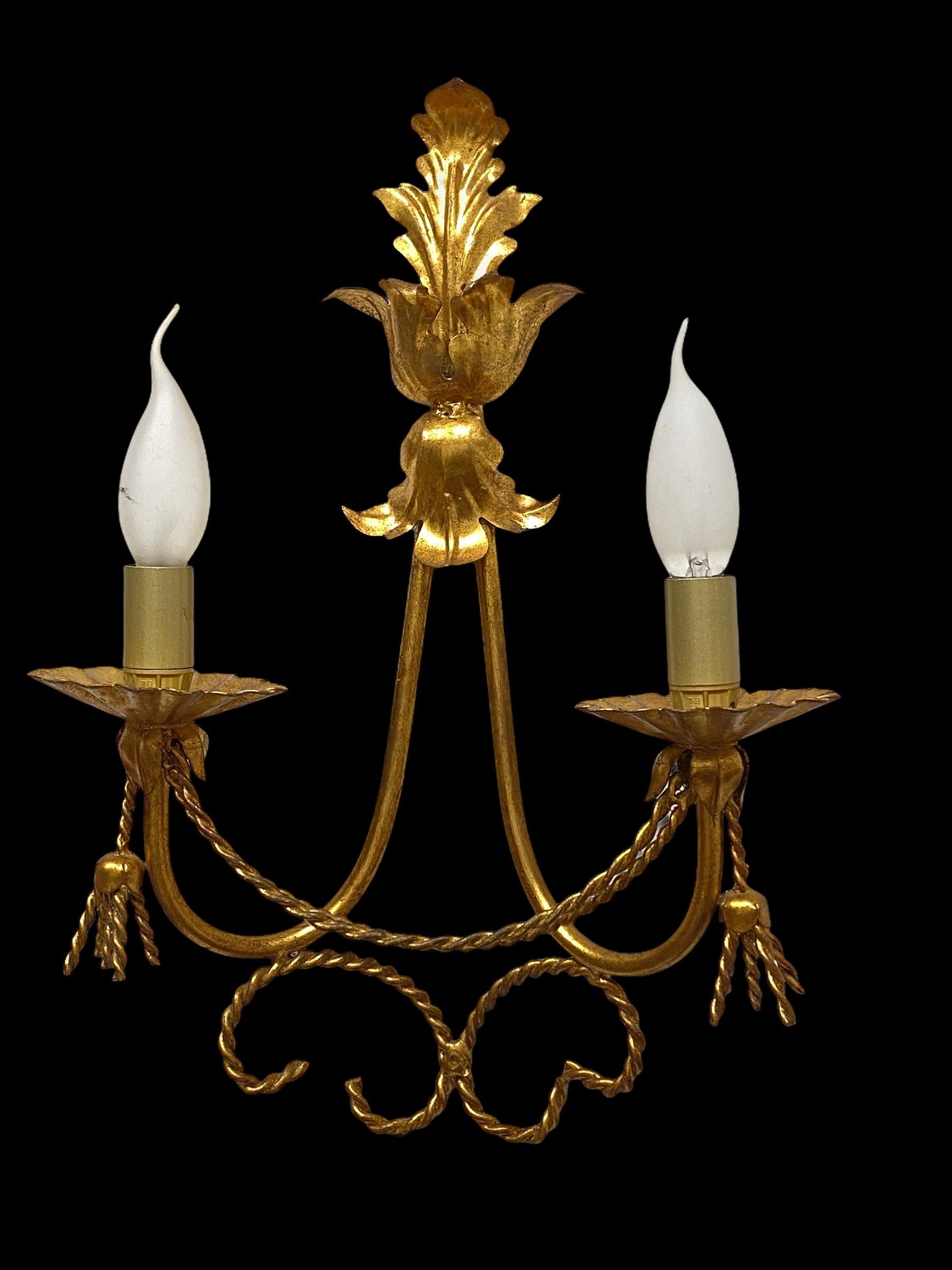 A single metal gilded sconce. The fixture requires two European E14 candelabra bulbs, each bulb up to 40 watts. The wall light has a beautiful color and gives each room an eclectic statement. Light bulbs are not included in this offer.