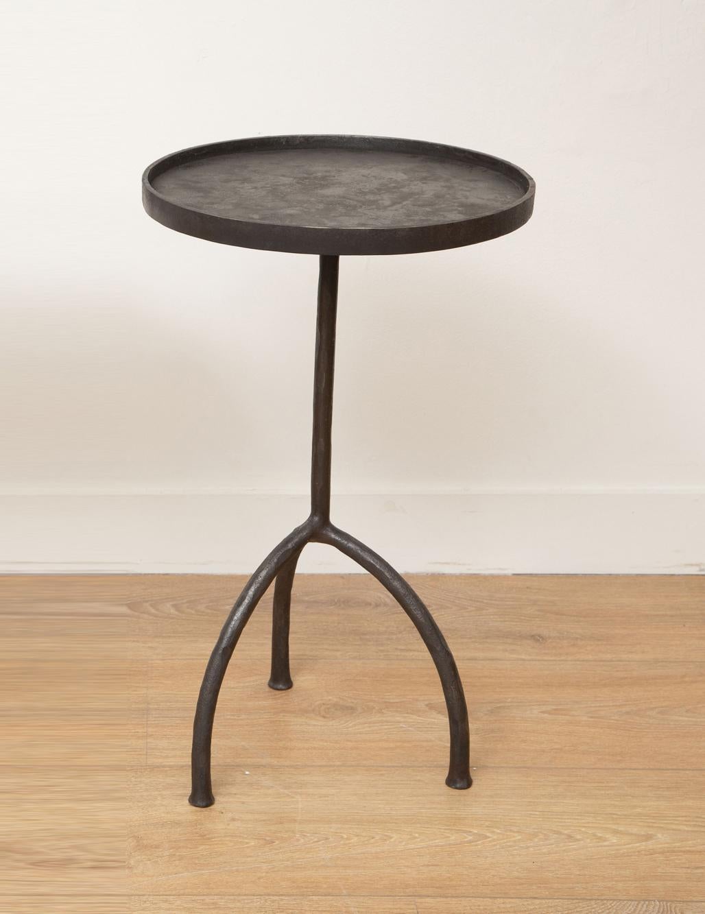 Single custom tripod hand-forged side or drinks table, in stock
Hand-forged iron legs, round top with lip
Dark bronze patina
Perfect for drinks, side, end table
Ready to ship from our showroom in Miami.