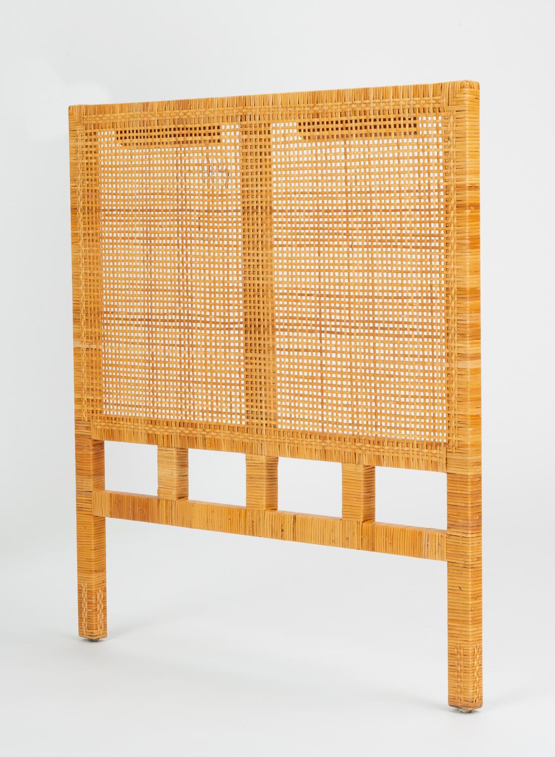 A single twin-sized headboard by Danny Ho Fong for his company, Tropi-Cal from the 1960s Parsons Group. This collection comprises mainly seating, but all pieces share construction in square posts, fully wrapped in a basket-woven cane with braided