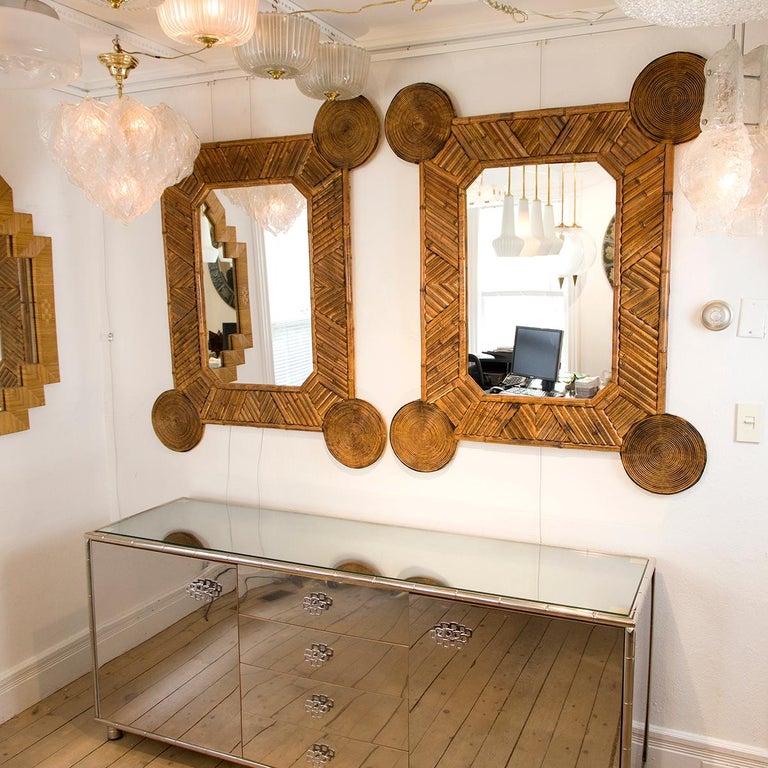 Single unusual mirror with intricate bamboo surround.