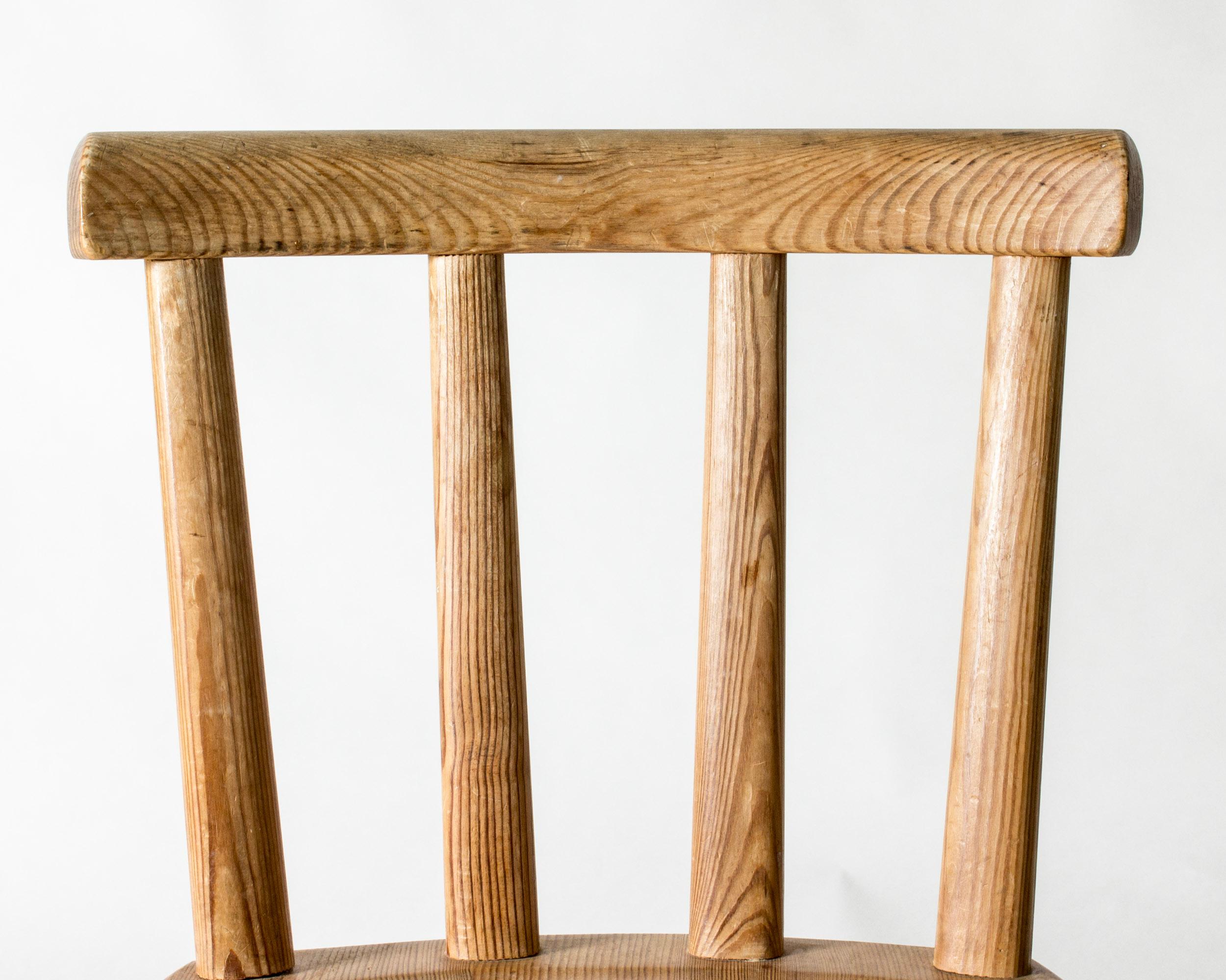 Single beautiful “Utö” dining chair, made from pine in an elegant design balancing rustic and modernism. Solid wood, sturdy feel. Lovely woodgrain.

“Utö” is one of the series of furniture included in NK:s “Sporstugemöbler”, “sports cabin’s
