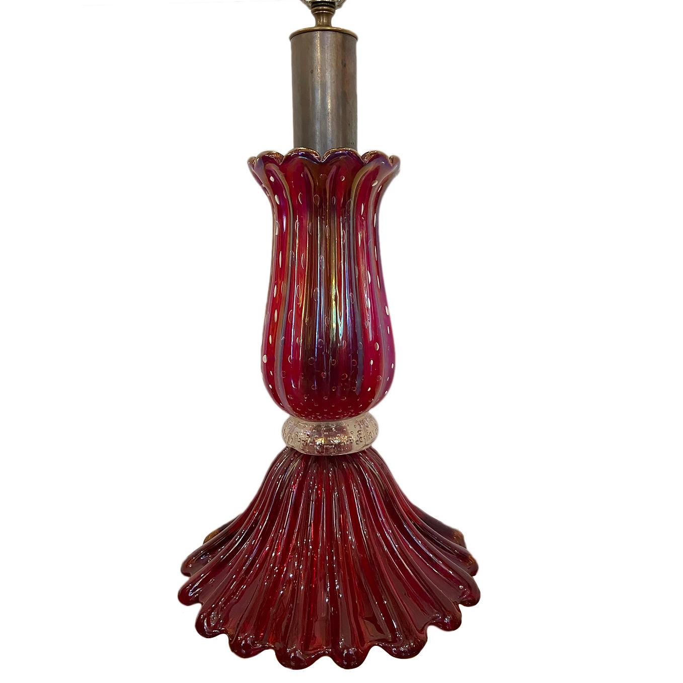 A circa 1940's single Venetian glass table lamp in red with gold waist.

Measurements:
Height of body 18
