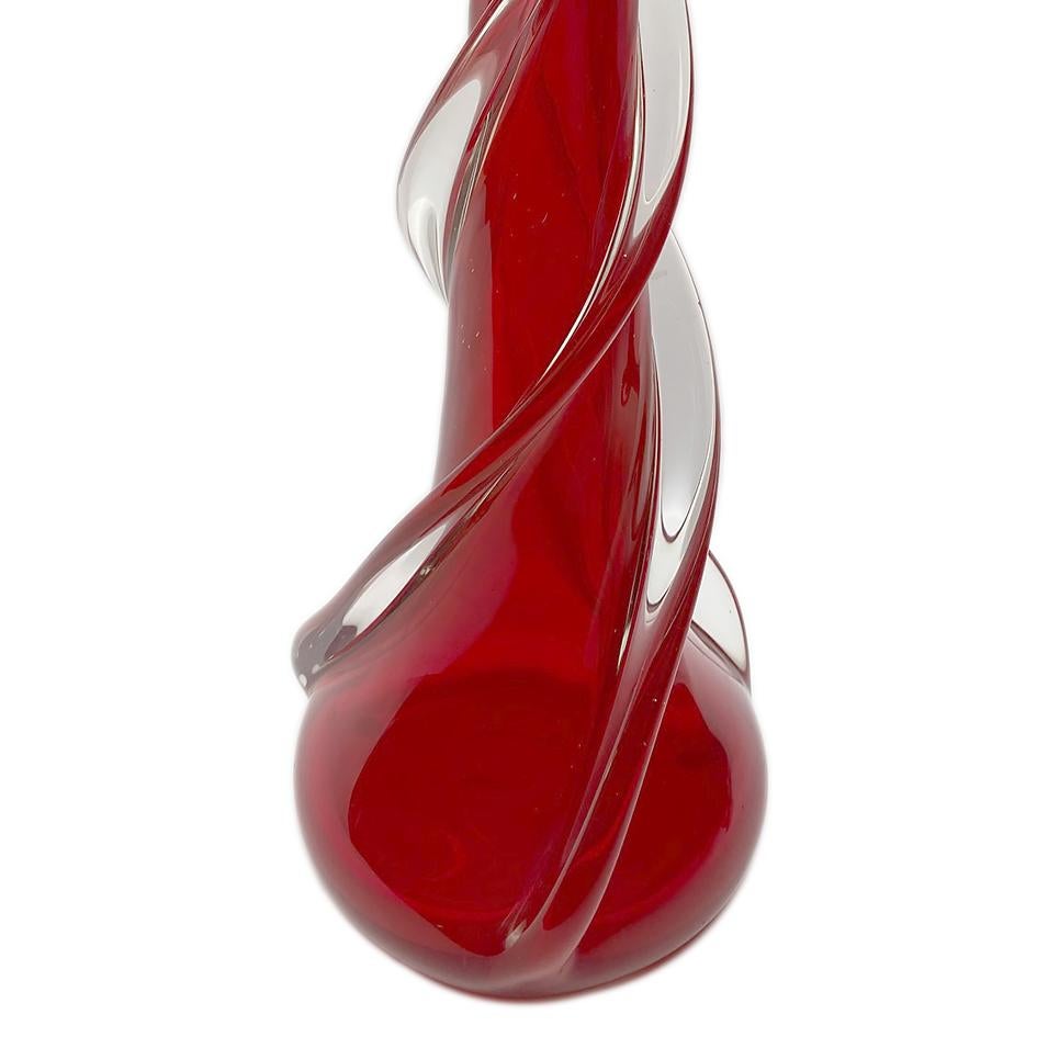 A circa 1930's Venetian glass table lamp in deep red glass incased in clear.

Measurements:
Height of body: 17