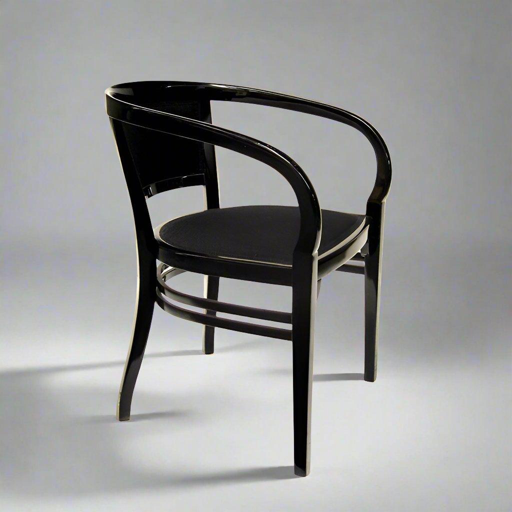 A Vienna Secession armchair.
Attributed to Josef Hoffmann. Black lacquered fruitwood.