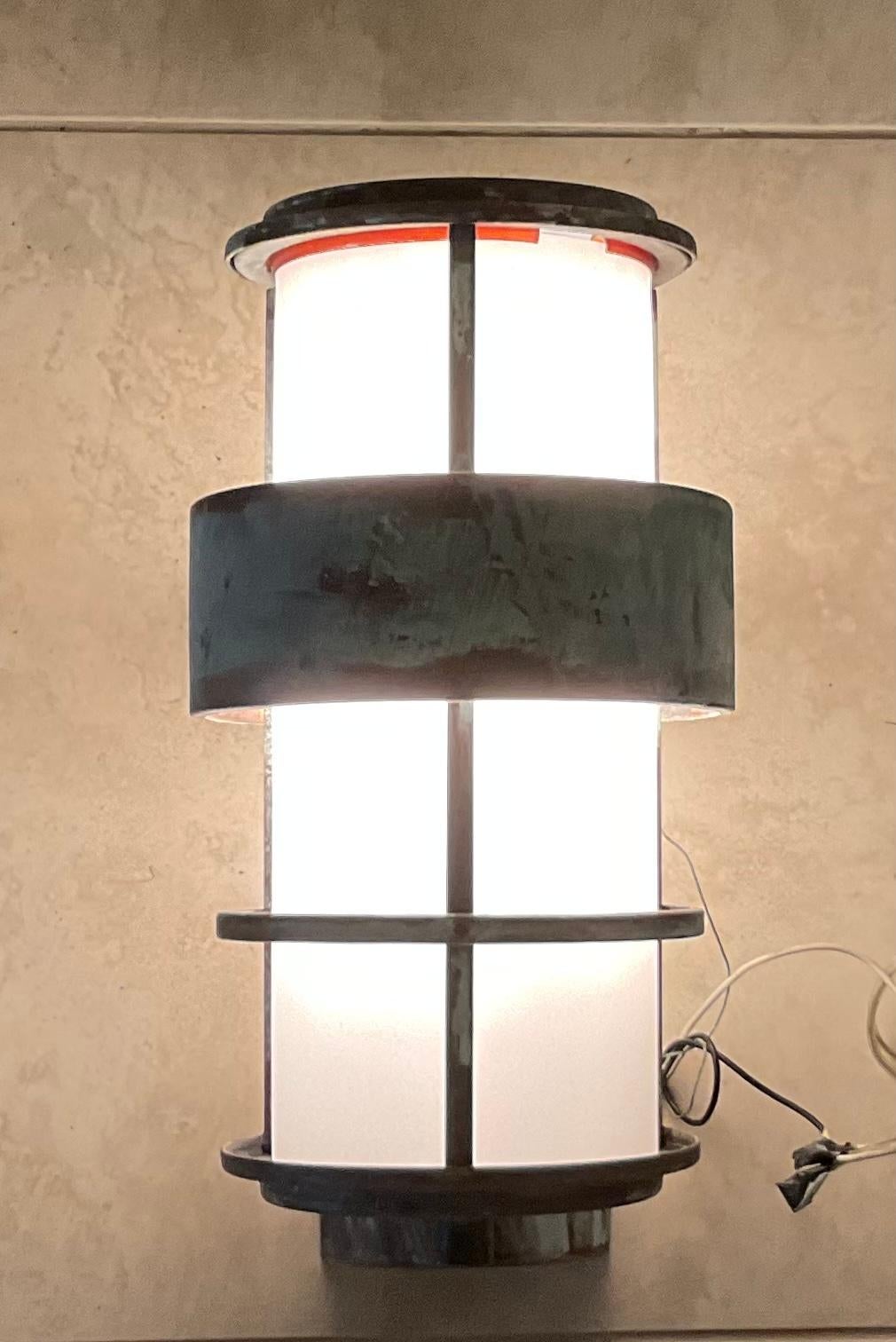 Single lantern or sconce made of solid brass frame with milk glass tube in the center reflecting 60/watt light each sconces.
Great decorative modern light for indoor or outdoor int the front of the house.