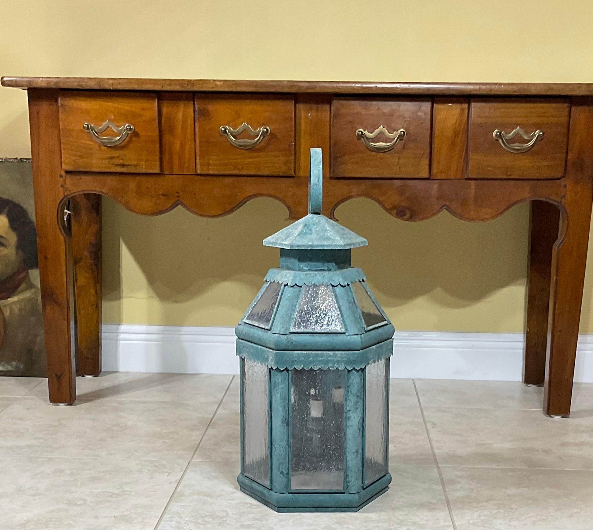 Funky vintage wall lantern handcrafted from solid brass, seeded glass, and three 40/watt lights suitable for wet location. Original hand painted patina one solid brass. Ready to use.