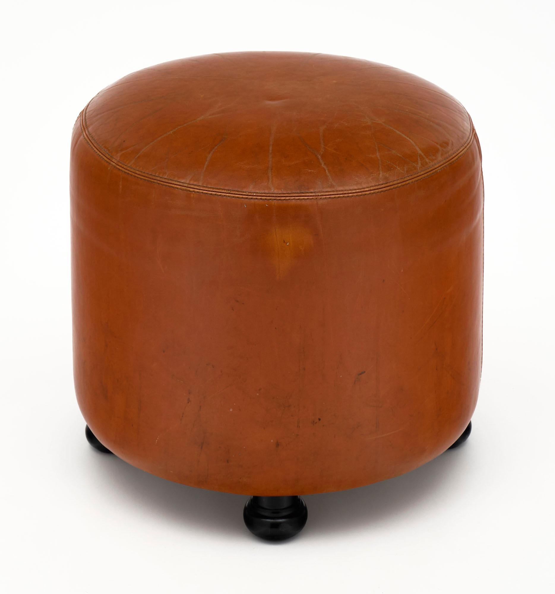 Stool from Milan, Italy with the original leather upholstery and wooden legs. There is a chair available as well that can be paired with it.