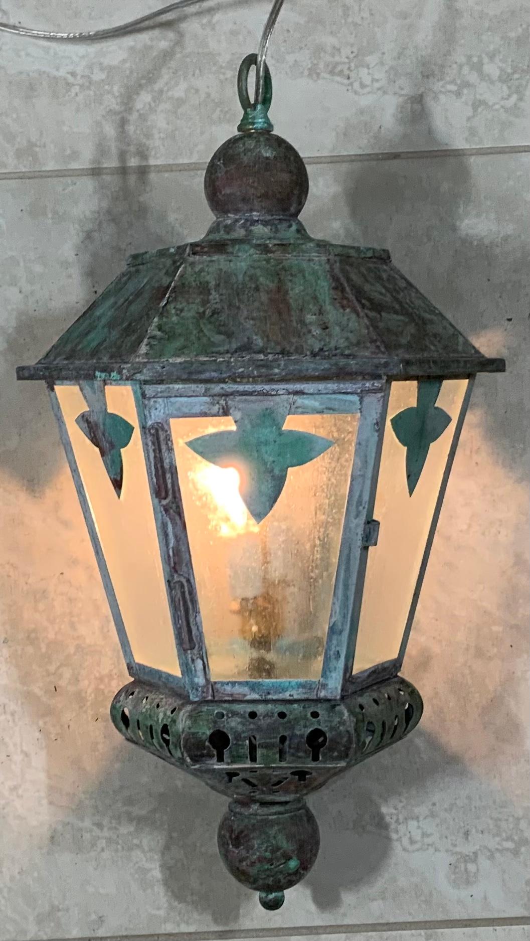 Artistically made vintage hand crafted solid brass and copper lantern with two 60/watt light, seeded acrylic glass like at all side, with beautiful patina. Originally was converted from wall lantern to hanging lantern, newly rewired. One decorative